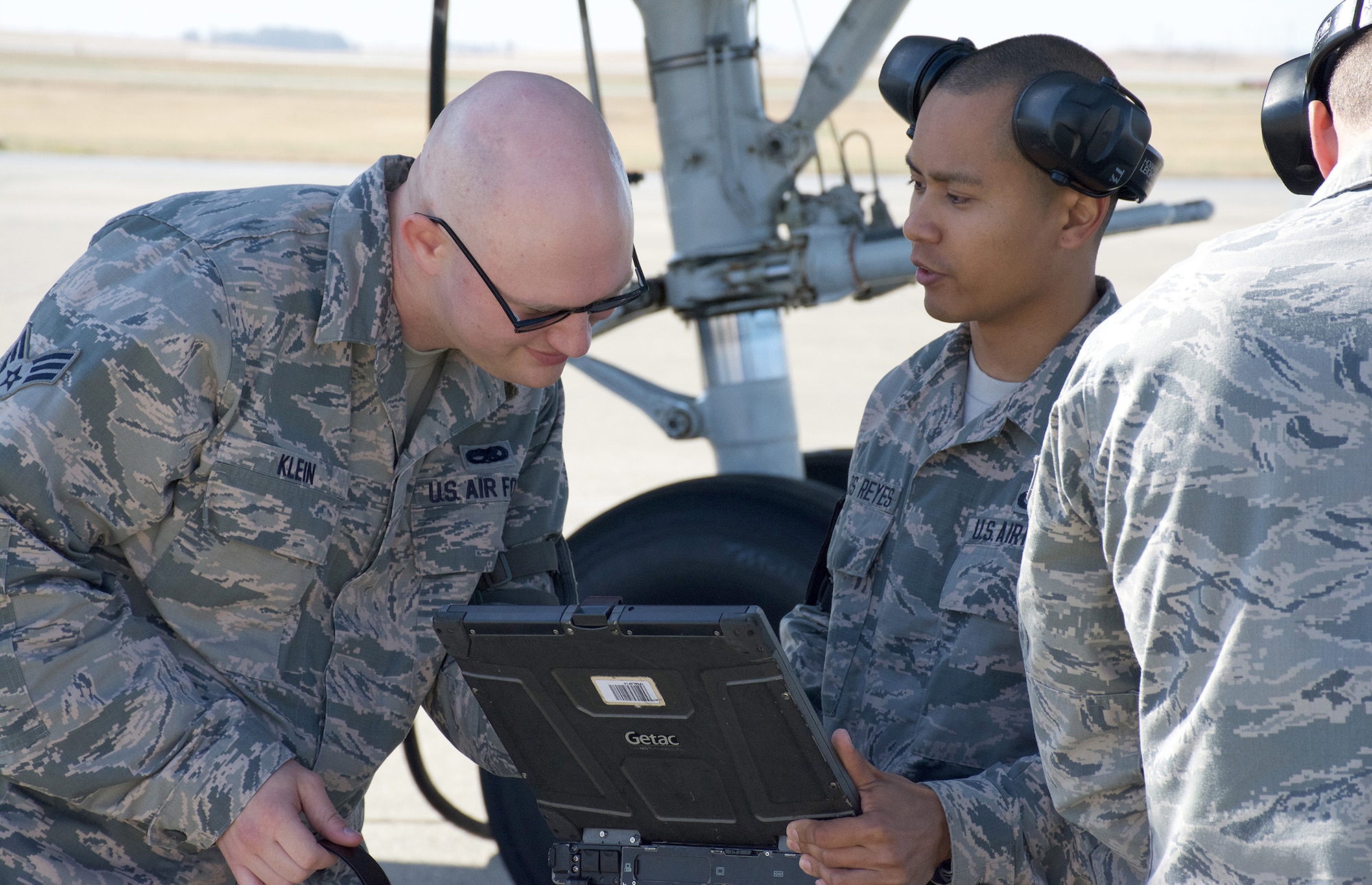 TRAVIS AIR FORCE BASE, Calif. --Senior Airmen Roger Klein and David Delos-Reyes review data on KC-10 Extender maintenance June 6, 2015 at Travis Air Force Base, California. Both Airmen, KC-10 crew chiefs, prepared the aircraft as part of an orientation flight for more than 15 Air Force Reservists assigned to the 349th Air Mobility Wing. The flight allowed wing top performers to experience the wing's aerial refueling mission. During the weekend, the 349th AMW hosted an Air Force Speciality Code Training Weekend, providing reservists with hands-on, realistic training that helps members hone their skills. The AFSC Training Weekend centered around the wing's ability to respond to a major earthquake in northern California, while working in concert with other military, federal and state agencies to provide relief and support where needed. (U.S. Air Force photo by 2nd Lt. Stephen J. Collier/Released)