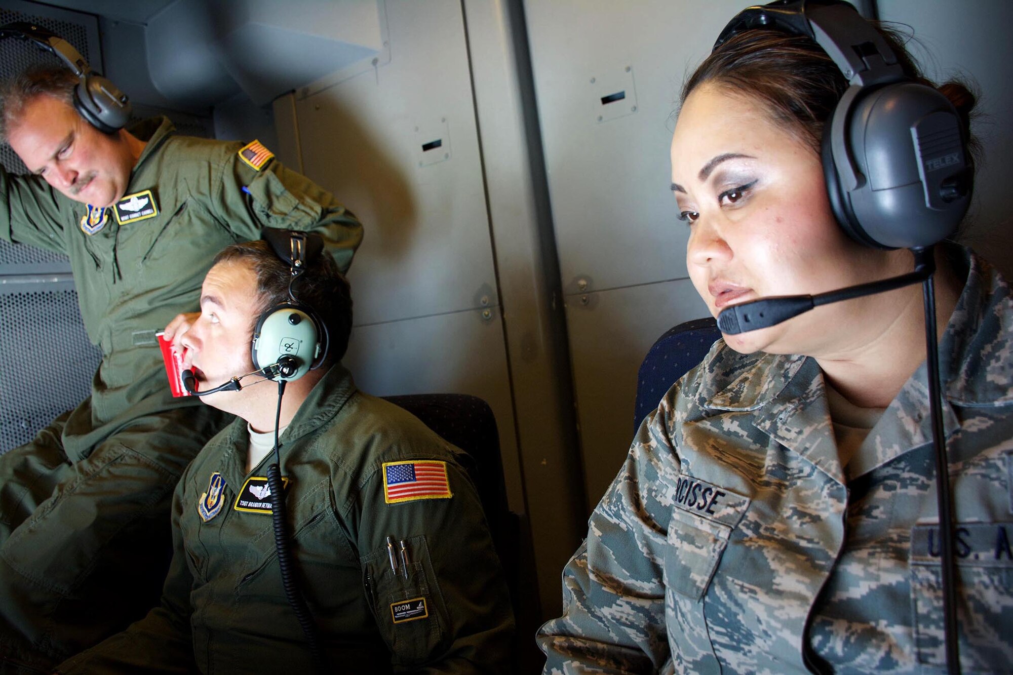 TRAVIS AIR FORCE BASE, Calif. --Senior Master Sgt. Sindy Narcisse looks on as a C-5M Super Galaxy connects with a KC-10 Extender June 6, 2015 over northern California. Narcisse was one of more than 15 Air Force Reservists assigned to the 349th Air Mobility Wing who took part in an orientation flight that allowed the wing top performers to experience the wing's aerial refueling mission. During the weekend, the 349th AMW hosted an Air Force Speciality Code Training Weekend, providing reservists with hands-on, realistic training that helps members hone their skills. The AFSC Training Weekend centered around the wing's ability to respond to a major earthquake in northern California, while working in concert with other military, federal and state agencies to provide relief and support where needed. Narcisse is assigned to the 349th Aerospace Medical Squadron. (U.S. Air Force photo by 2nd Lt. Stephen J. Collier/Released)