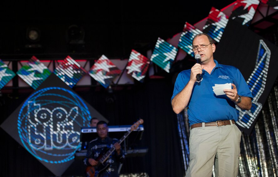 U.S. Air Force Norman Dozier, 23d Mission Support Group commander, welcomes the crowd prior to a Tops in Blue performance June 12, 2015, at Wild Adventures in Valdosta, Ga. Valdosta was the second stop on the seven-month 2015 Tops in Blue world tour. (U.S. Air Force photo by Andrea Jenkins/Released)
