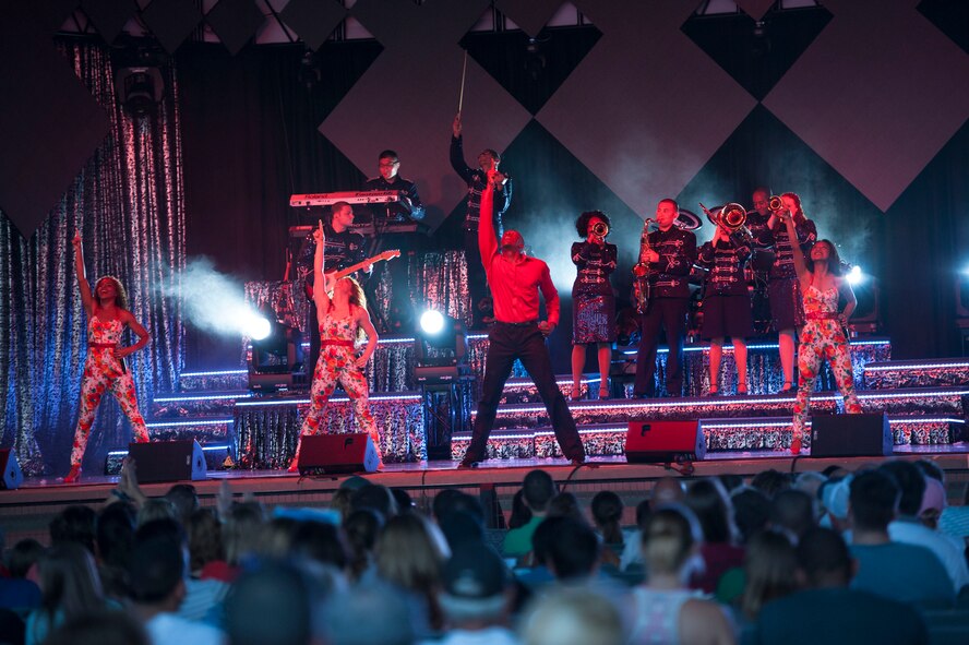 Tops in Blue performers entertain during a performance June 12, 2015, at Wild Adventures in Valdosta, Ga. Tops in Blue tours worldwide in an effort to raise morale for service members and their families, promote community relations and support recruiting efforts. (U.S. Air Force photo by Andrea Jenkins/Released)
