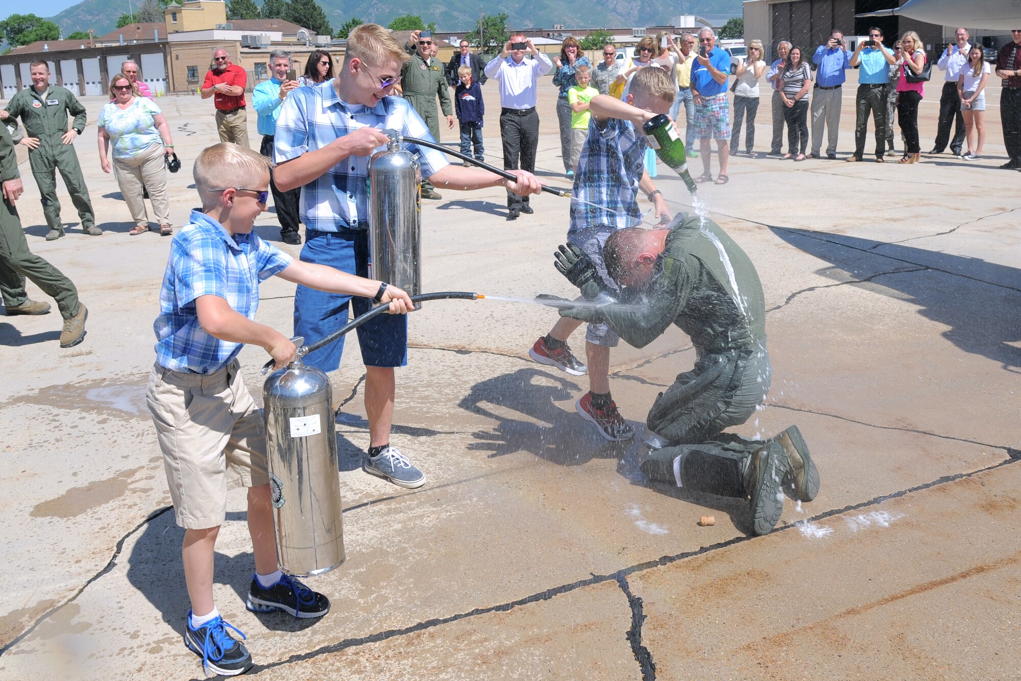 388th Fighter Wing Commander Col. Lance Landrum is taped up and soaked immediately after his "fini flight", an Air Force tradition in which pilots celebrate their last flight as part of the unit. (U.S. Air Force photo by Todd Cromar) 