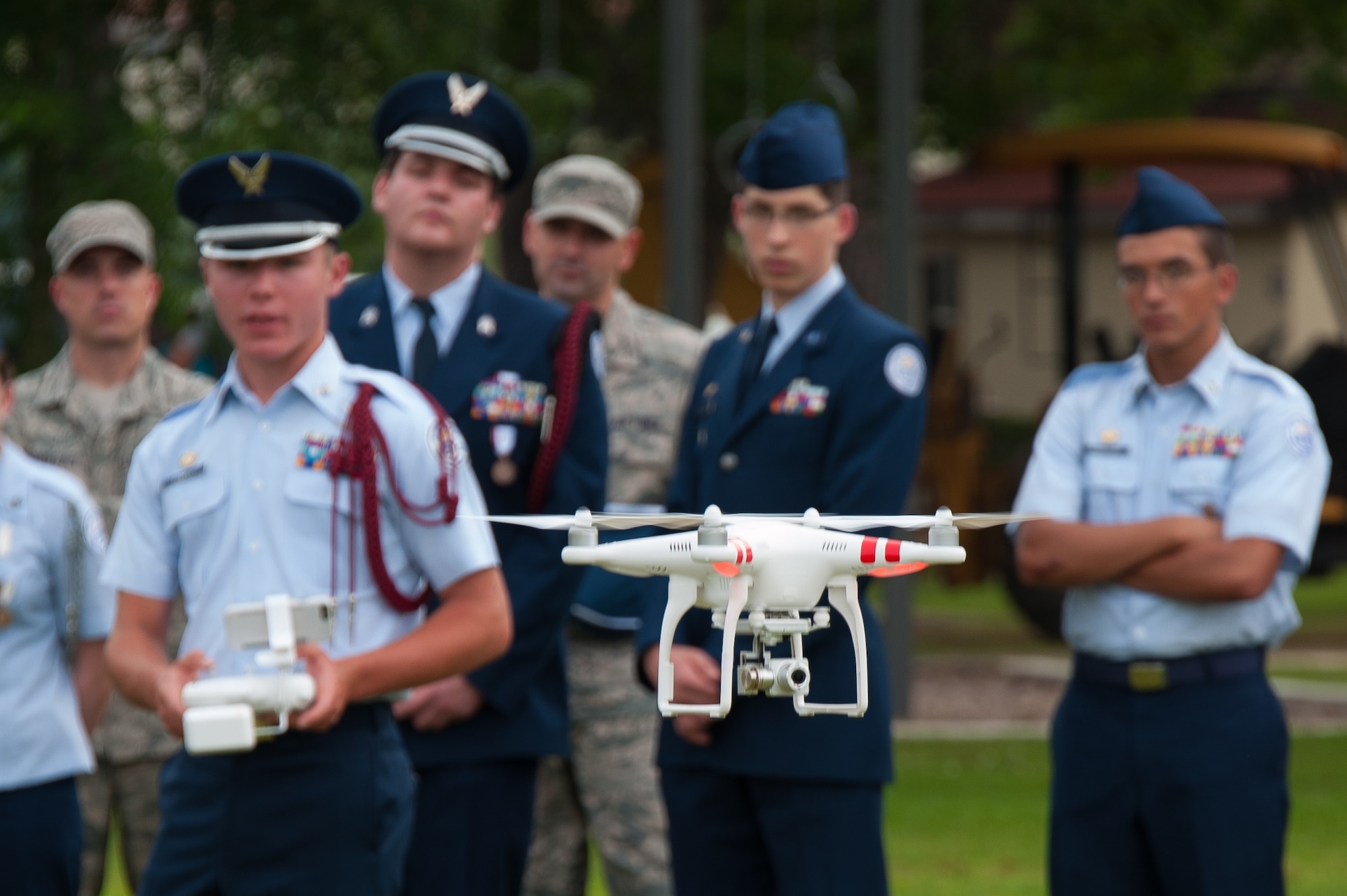 Cadet Senior Airman Cody Powell, Niceville High School Junior Reserve Officer Training Corps, maneuvers a multicopter during a demonstration held at Maxwell Air Force Base, Alabama, June 10, 2015.  About 17 cadets from the Florida high school were at Maxwell to demonstrate the capabilities of their newest science, technology, engineering and mathematics, or STEM, teaching and learning tool they call the multicopter, or quadcopter, a remote-controlled aircraft propelled by four rotors. Cadets learn how to fly the multicopter and maneuver its camera while also learning how to work in a team environment.  (Air Force Photo by Melanie Rodgers Cox/Cleared)