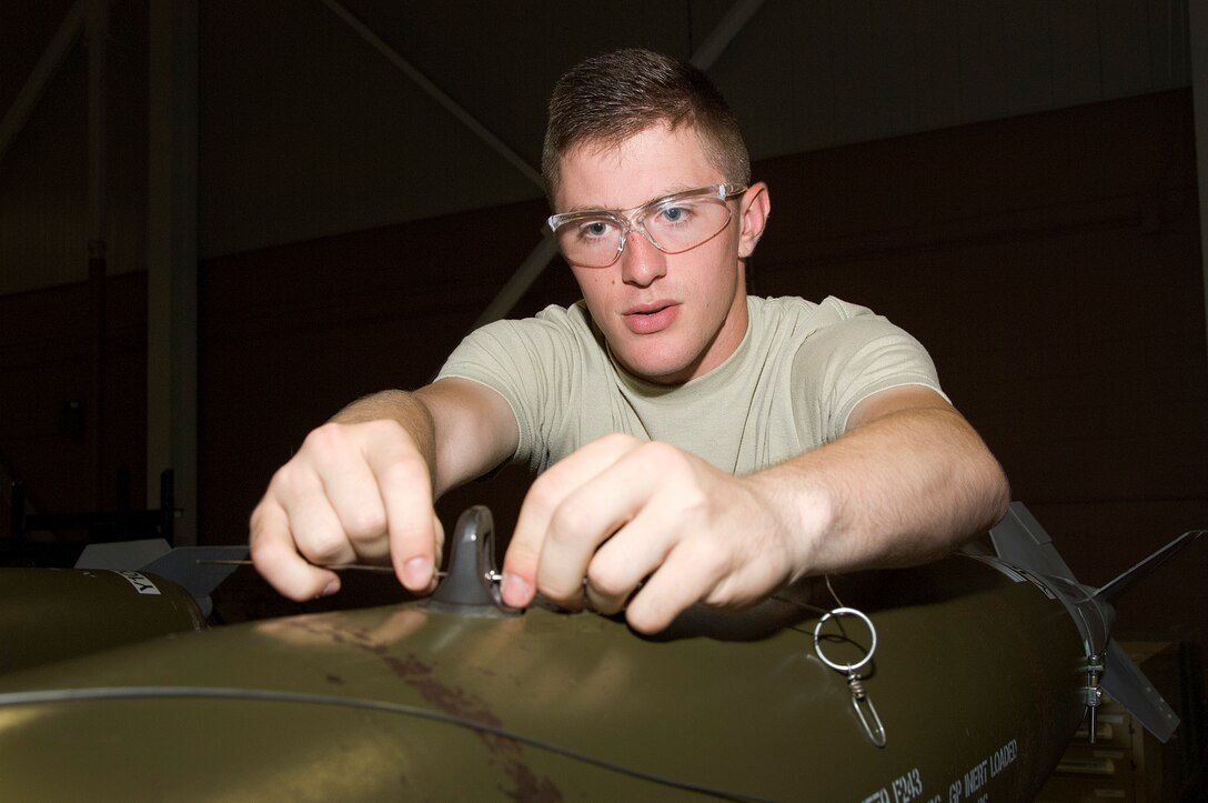 Airman 1st Class Sean Wilson, 363rd Training Squadron, mounts arming wire to
a munitions system during training June 16, 2015 at Sheppard Air Force Base,
Texas. The 363rd Training Squadron provides training for armament,
munitions, nuclear weapons and maintenance scheduling and analysis. (U.S.
Air Force photo by Danny Webb/Released)

