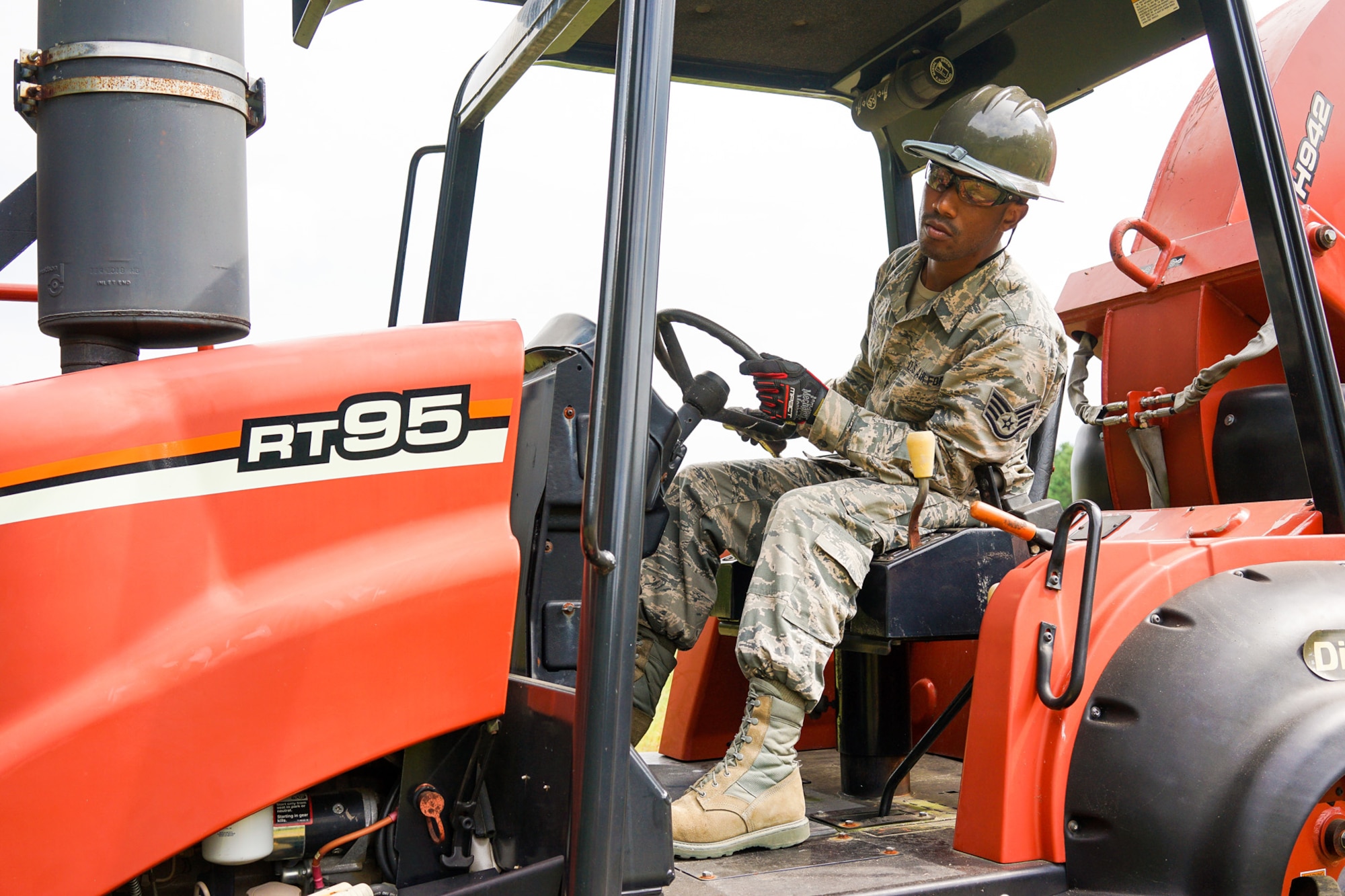 U.S. Air Force Staff Sgt. Joseph Jones, a cable and antenna systems specialist with the 202nd Engineering Installation Squadron (EIS), Georgia Air National Guard, views the progress of a trench he is digging using a trencher with a backhoe attachment during a weeklong training exercise at Robins Air Force Base, Ga., June 11, 2015. More than 80 Airmen were certified in career-field tasks crucial to the unit’s deployed and homeland missions. The 202nd EIS supports the 116th Air Control Wing and is responsible for the fixed-communications infrastructures for 27 other locations, including the 165th Airlift Wing in Savannah, Georgia, and Air National Guard units in Puerto Rico and the U.S. Virgin Islands. (U.S. Air National Guard photo by Senior Master Sgt. Roger Parsons/Released)