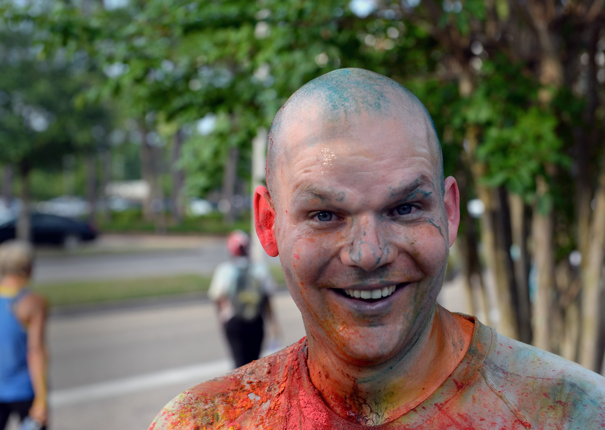 Tech. Sgt. Mark Baker, Mathies NCO Academy student, catches his breath after completing Wingman Week’s “Resilient Color Me 5K” June 8, 2015, Keesler Air Force Base, Miss. More than 170 Keesler personnel and family members participated in the run/walk, which featured a color station for each domain of Comprehensive Airman Fitness – social, spiritual, mental and physical. (U.S. Air Force photo by Airman 1st Class Duncan McElroy)