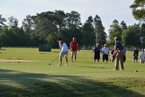 (Left) BGen. Alain Pelletier, Deputy Commander, Continental North American Aerospace Defense  Command Region and Parker Mayor Rich Musgrave,  line up their inaugural tee shots to start the CAN-AM 2015 Golf Tournament May 28. Hosted by the Canadian contingent at CONR-1st Air Force ( Air Forces Northern), the tournament is an annual event with a portion of the proceeds going to a local community charity. This year, the charity was Guardian ad Litem in Panama City. (Air Force photo released/Courtesy photo)