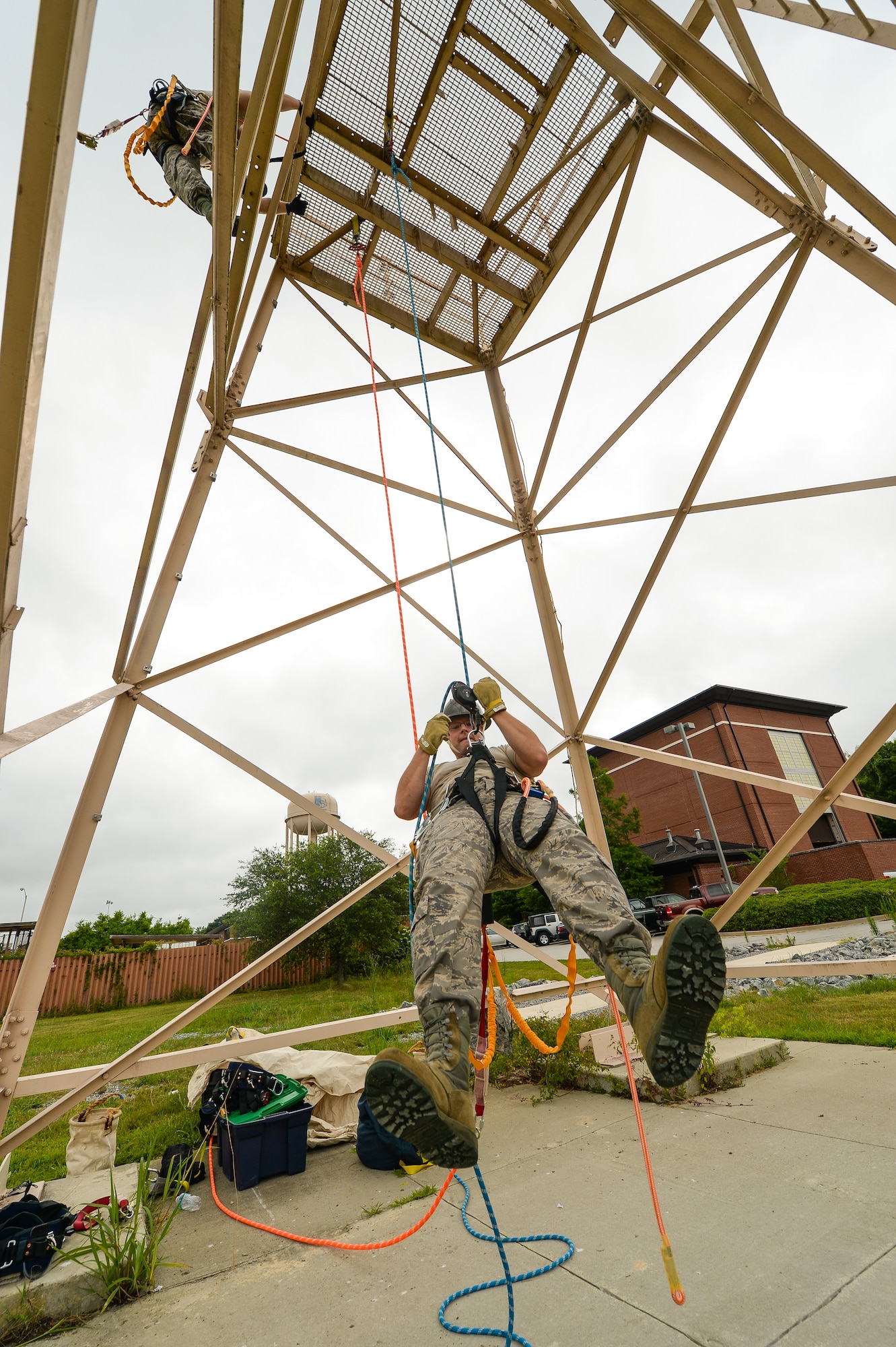 U.S. Air Force Staff Sgt. Andrew Batson, a cable antenna technician with the 202nd Engineering Installation Squadron (EIS), Georgia Air National Guard, repels from a tower during a tower climbing and rescue training exercise being conducted during the unit’s annual training at Robins Air Force Base, Ga., June 10, 2015. The 202nd EIS’s enlisted and officer engineers, draftsmen, cable and electronics professionals design and install communications infrastructures. Some of their duties include building antennas, towers, fiber optics, and surveillance equipment, to access control and intrusion detection systems anywhere in the world. (U.S. Air National Guard photo by Senior Master Sgt. Roger Parsons/Released) 