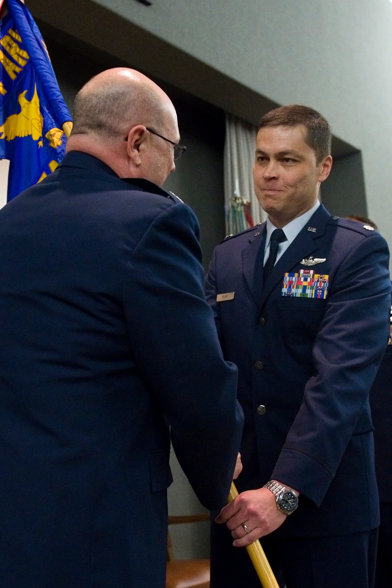 Lt. Col. Brian Burr, 74th Air Refueling Squadron commander, receives the 74th ARS guidon from Col. Mark Sigler, 434th Operations Group commander, during a ceremony at Grissom Air Reserve Base, Ind., June 6, 2015. Burr replaced Lt. Col. James West as the unit commander. (U.S. Air Force photo/Tech. Sgt. Benjamin Mota)