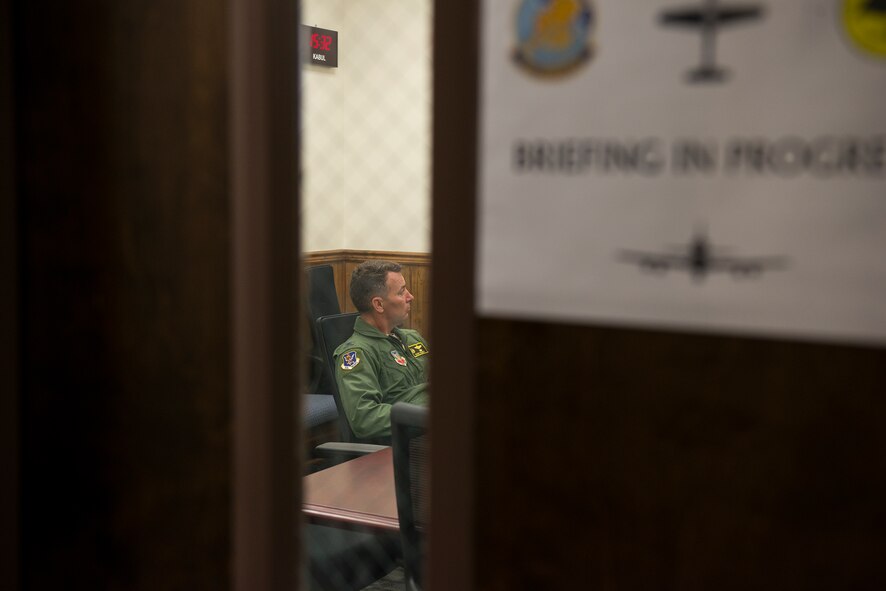 U.S. Air Force Col. Chad Franks, 23d Wing commander, listens during an egress briefing June 16, 2015, at Moody Air Force Base, Ga. Franks toured the 81st Fighter Squadron and flew on the A-29 Super Tucano to experience its Afghan training mission. (U.S. Air Force Airman 1st Class Ceaira Tinsley/Released)