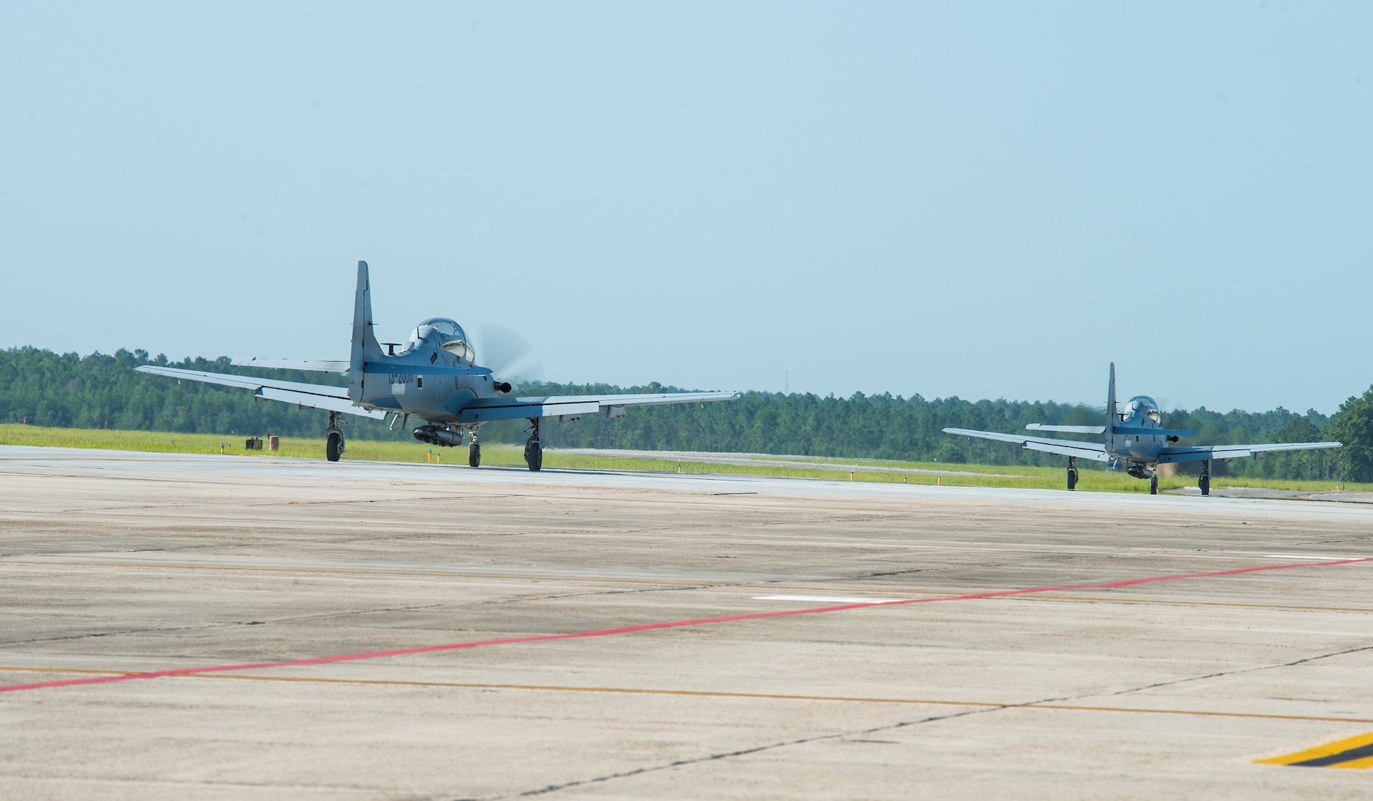 Two A-29 Super Tucanos prepare for takeoff prior to U.S. Air Force Col. Chad Franks, 23d Wing commander, first flight with the 81st Fighter Squadron June 16, 2015, at Moody Air Force Base, Ga. The 81st FS trains Afghan Air Force pilots and maintainers. (U.S. Air Force Airman 1st Class Ceaira Tinsley/Released)