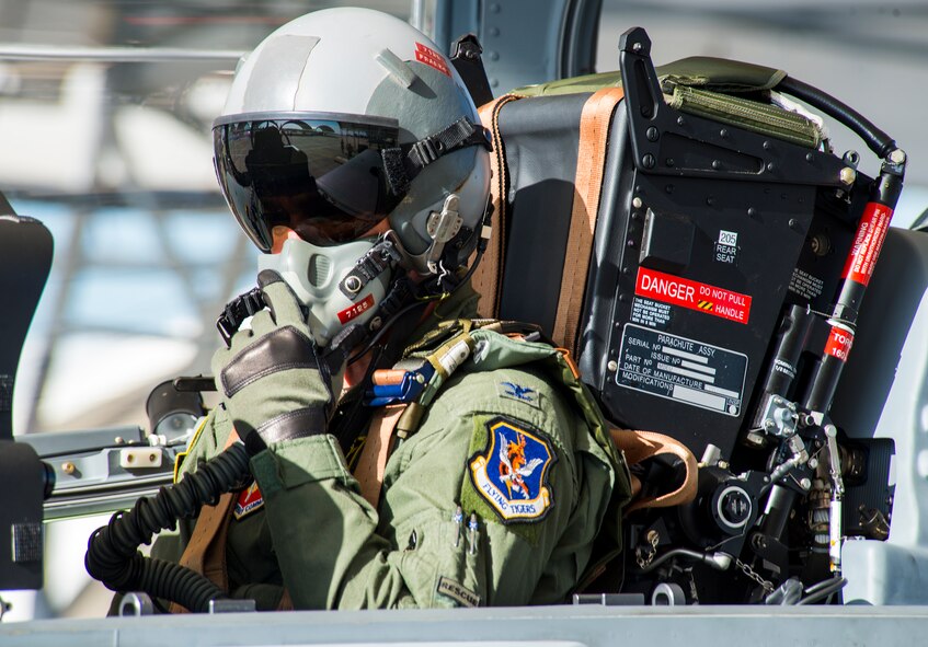 U.S. Air Force Col. Chad Franks, 23d Wing commander, adjusts the communications panel before his flight with the 81st Fighter Squadron June 16, 2015, at Moody Air Force Base, Ga. Franks used the panel to communicate with the pilot throughout the flight. (U.S. Air Force Airman 1st Class Ceaira Tinsley/Released)