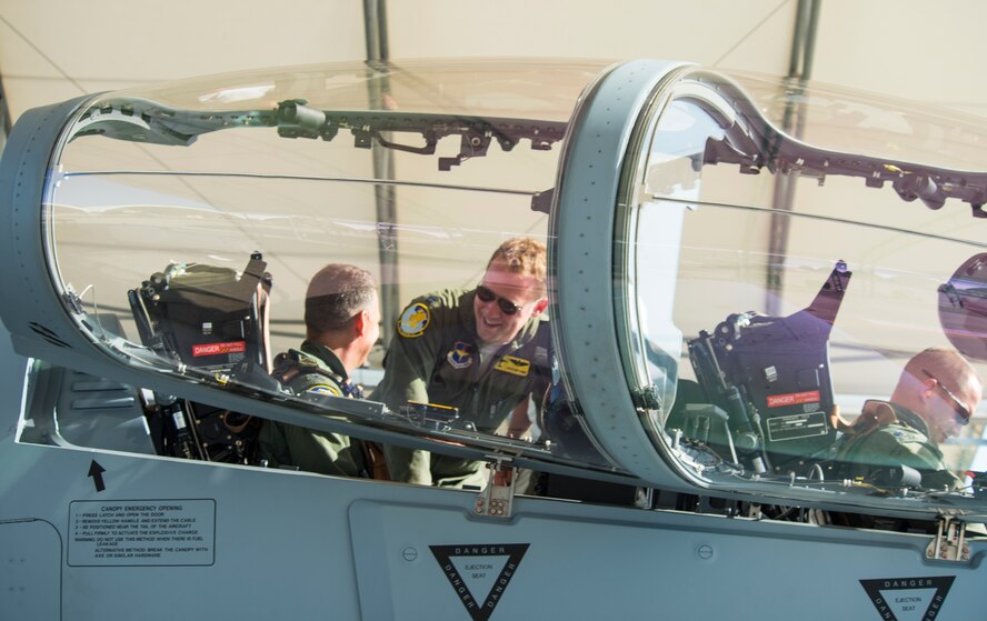 An 81st Fighter Squadron pilot identifies the different parts of the A-29 Super Tucano to U.S. Air Force Col. Chad Franks, 23d Wing commander, before takeoff June 16, 2015, at Moody Air Force Base, Ga. The 81st FS reactivated in January 2015 to train approximately 30 Afghan pilots and 90 maintainers at Moody. (U.S. Air Force Airman 1st Class Ceaira Tinsley/Released)
