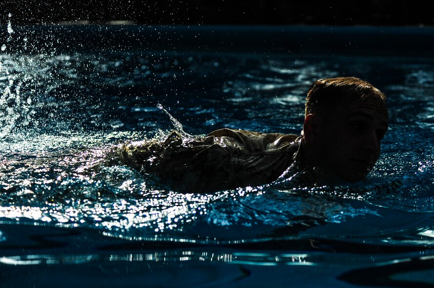 U.S. Marine Lance Cpl. Cody Kelton, 3rd Battalion, 8th Marine Regiment, completes a 250-meter swim as part of the intermediate course of USMC Water Survival Training, June 10, 2015, at Camp Lejeune, North Carolina. In order to pass this portion of the course, Marines had to properly perform a pencil dive and swim five laps in the 50-meter-wide pool without touching the bottom or sides.  (U.S. Air Force photo/Senior Airman Brittain Crolley)