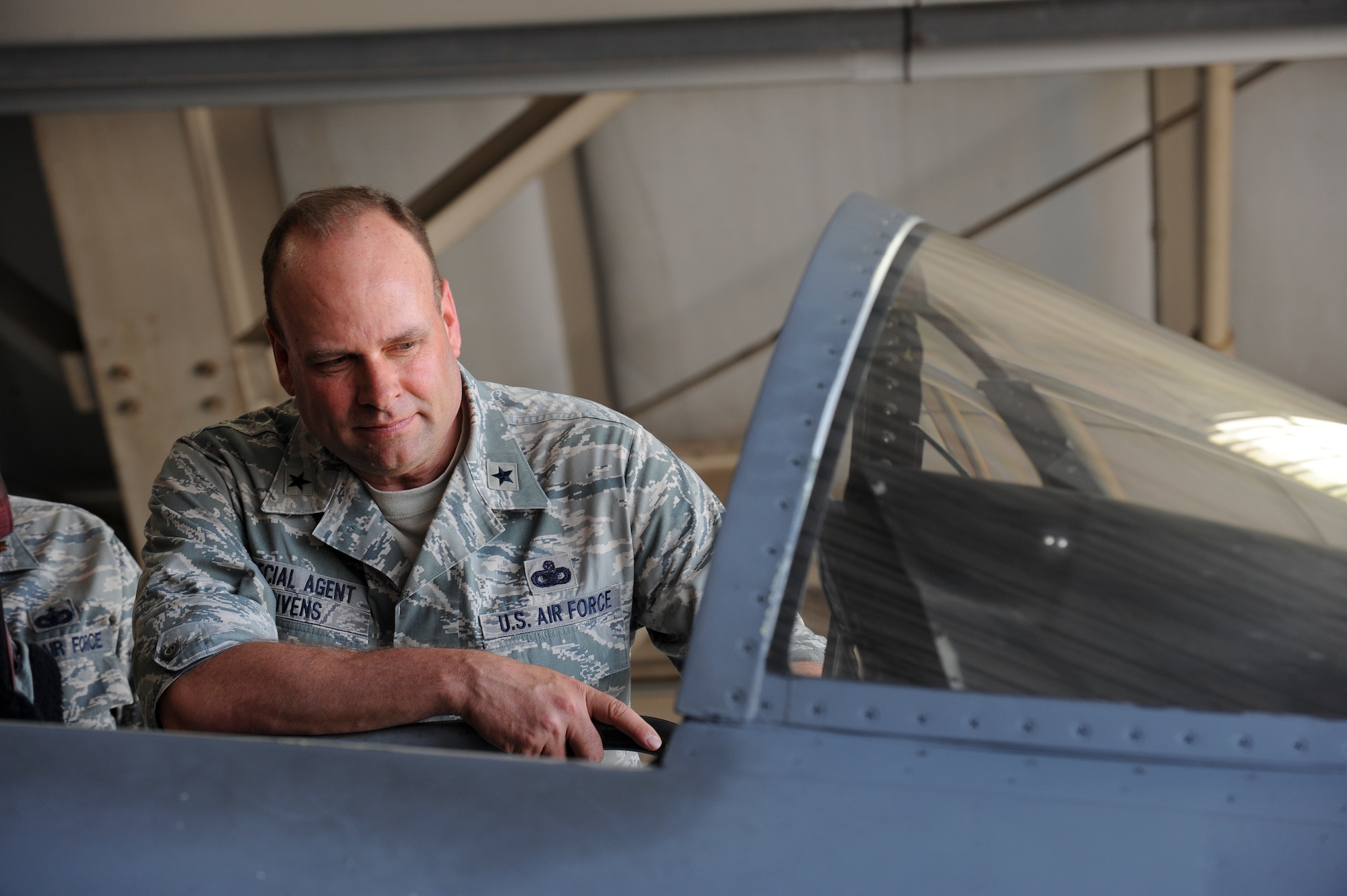 Brig. Gen. Keith Givens, Air Force Office of Special Investigation commander, observes the cockpit of an F-15E Strike Eagle during a tour of the 336th Fighter Squadron, June 11, 2015, at Seymour Johnson Air Force Base, North Carolina. Givens toured the squadron during a two day site visit where he met with Team Seymour’s senior leaders and members of AFOSI Detachment 216 to discuss local threats. (U.S. Air Force photo/Airman 1st Class Aaron J. Jenne)