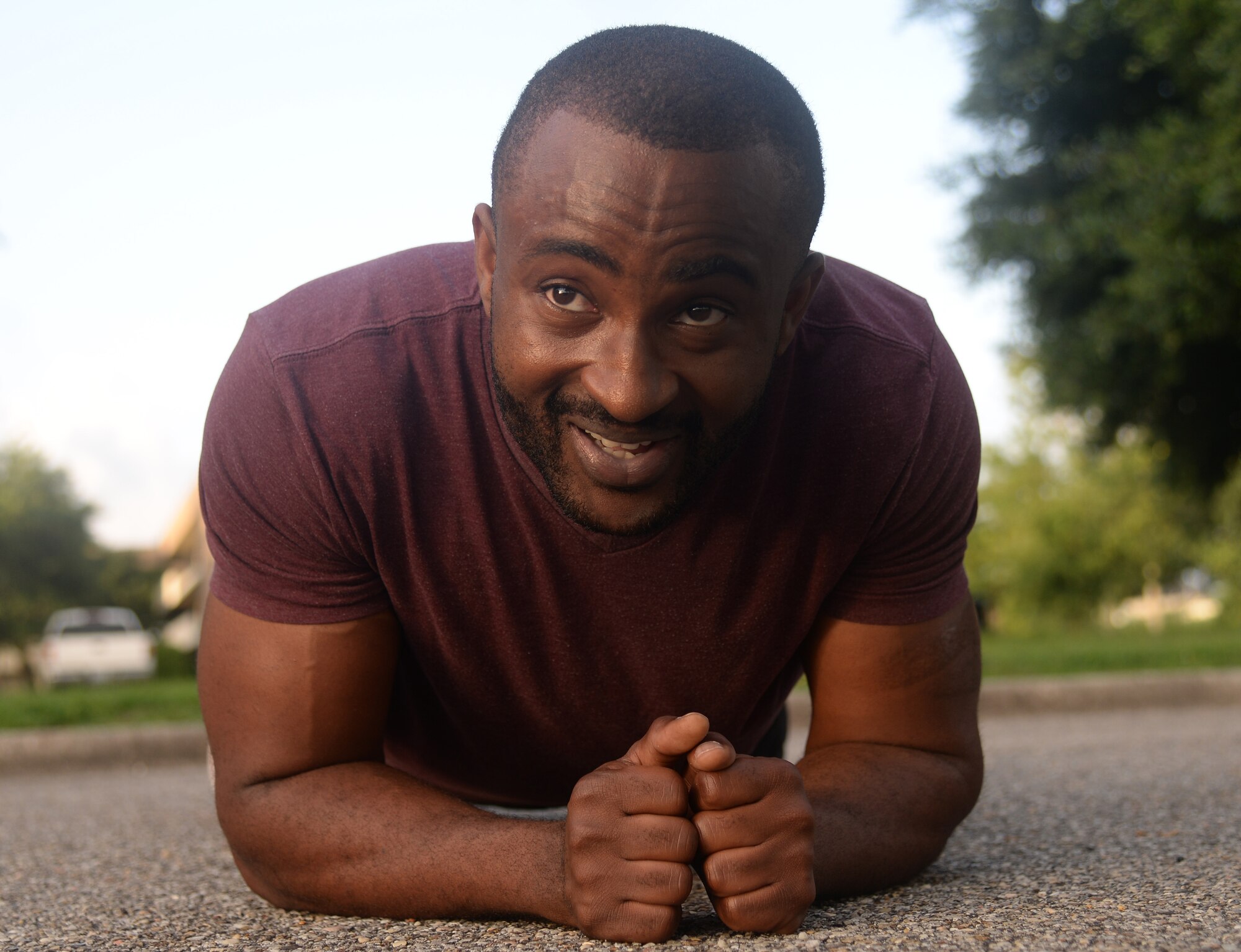 Senior Airman Chigozie Nwachukwu, 81st Comptroller Squadron military pay technician, performs a plank at squadron physical training, June 16, 2015, Keesler Air Force Base, Miss. The 81st CPTS conducts PT three times a week to build physical strength and foster squadron unity. (U.S. Air Force photo by Senior Airman Holly Mansfield)