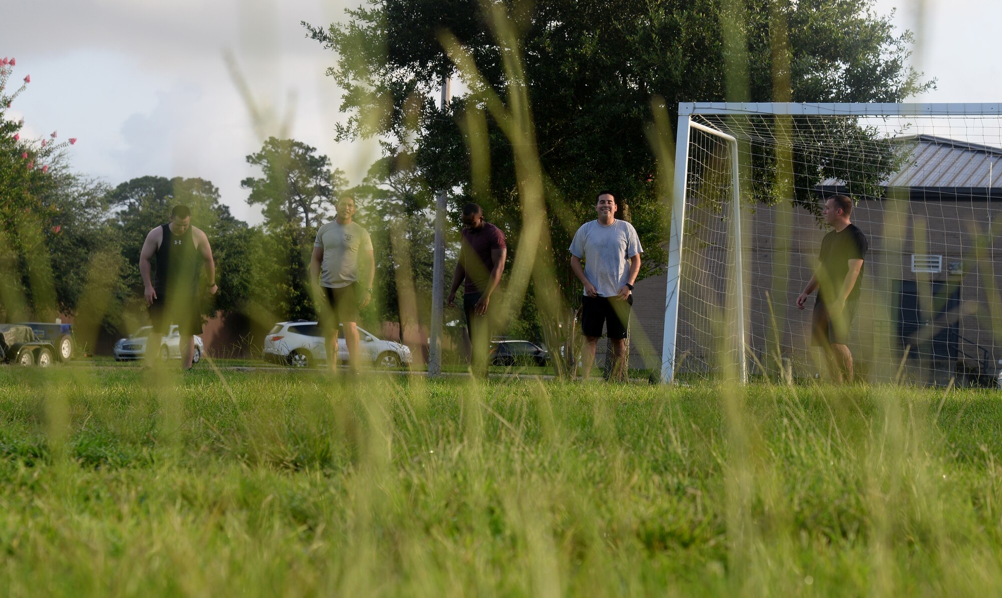 Members of the 81st Comptroller Squadron prepare to run sprints at squadron physical training, June 16, 2015, Keesler Air Force Base, Miss. The 81st CPTS conducts PT three times a week to  build physical strength and foster squadron unity. (U.S. Air Force photo by Senior Airman Holly Mansfield)