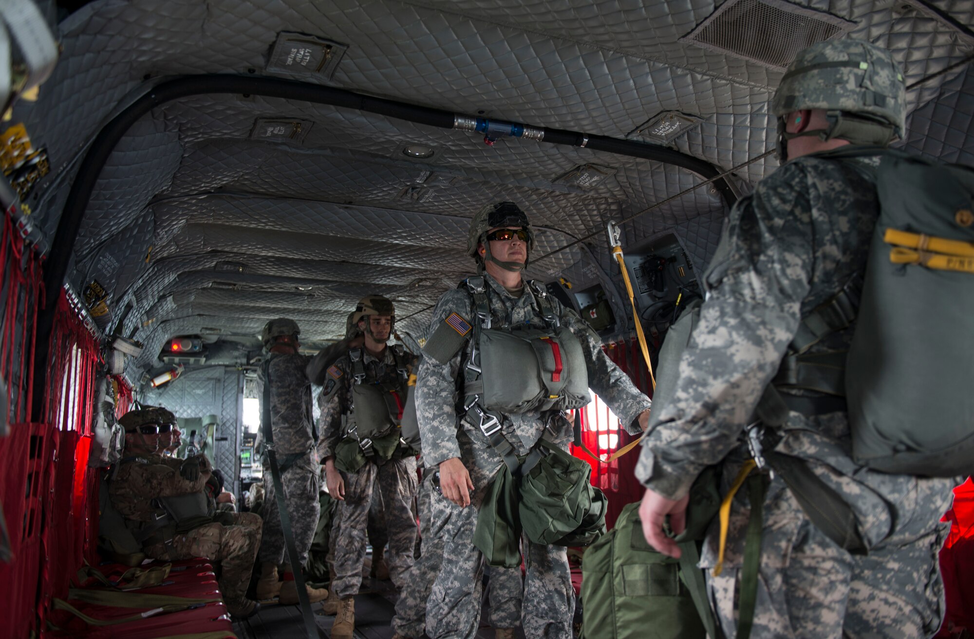 Members of the 404th Civil Affairs Battalion prepare to jump from the back of a CH-47 Chinook during training on Joint Base McGuire-Dix-Lakehurst, N.J. June 12, 2015. Capt. Jennifer Wertz, 404th CAB team leader,  also took time during training to re-commission after acceptance into the U.S. Army Nurse Corps.  (U.S. Air Force photo by Airman 1st Class Joshua King)