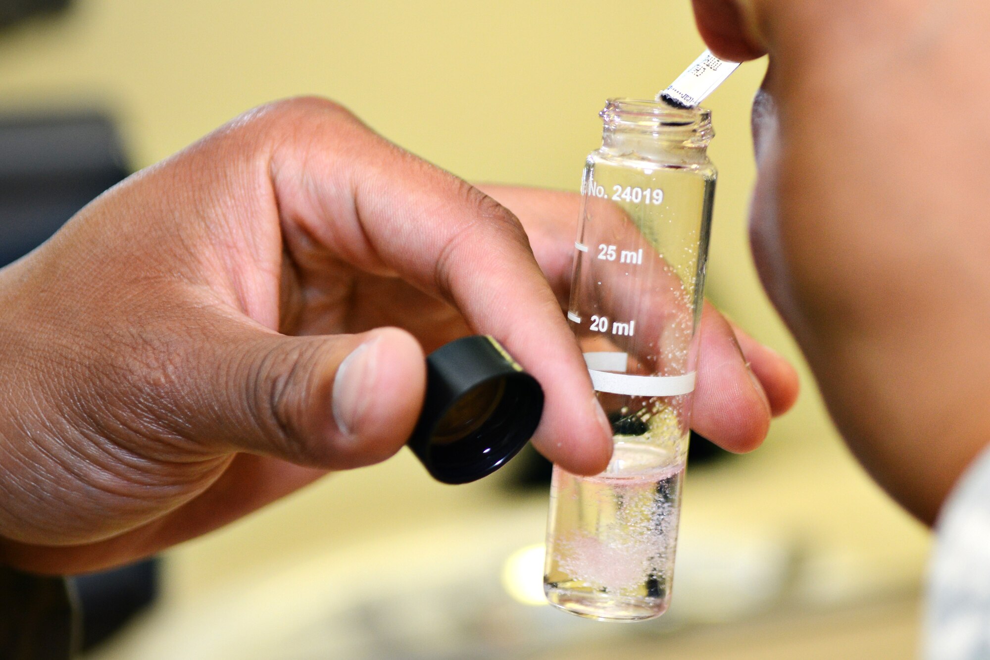 U.S. Air Force Airman Alex McClendon, 633rd Aerospace Medicine Squadron bioenvironmental engineering technician, adds a de-chlorinating solution to a tap water sample at Langley Air Force Base, Va., June 12, 2015. If the water fails to meet the Air Force’s health standards, base civil engineers will flush the system, locate the problem. (U.S. Air Force photo by Airman 1st Class Devin S. Michaels/Released)