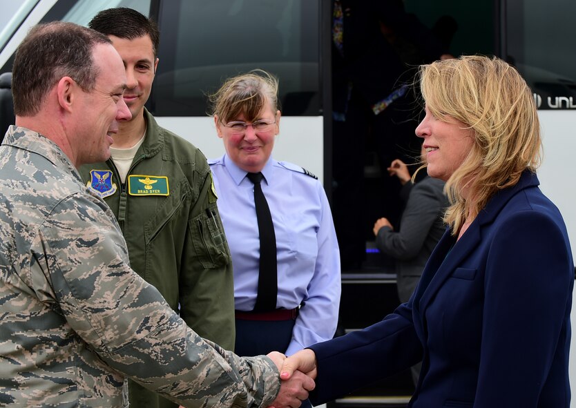 U.S. Air Force Col. Kevin Cullen, 501st Combat Support Wing, commander, thanks Secretary of the Air Force Deborah Lee James for visiting at RAF Fairford, United Kingdom prior to her departure, June 17, 2015. During James visit she was able to see and hear how RAF Fairford serves a unique and has a strategic role in bomber contingency operations in Europe especially as Air Force Global Strike Command are participating in the multi-national BALTOPS 2015 and Saber Strike exercises at RAF Fairford. (U.S. Air Force photo by Tech. Sgt. Chrissy Best)