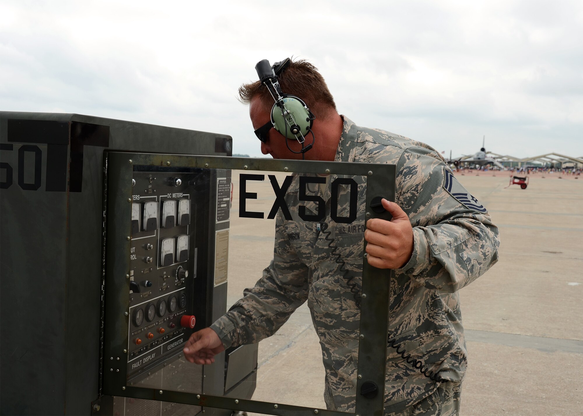Senior Master Sgt. Phil Johnson, maintenance flight chief with the 131st Maintenance Squadron, assists civil and military aerial performers with aircraft ground support services such as refueling and filling oil smoke tanks used during performances during the Wings Over Whiteman air show June 13, 2015.  A number of Citizen-Airmen from the Missouri Air National Guard’s 131st Bomb Wing were on hand to support the two-day event.  (U.S. Air National Guard photo by Airman 1st Class Halley Burgess)