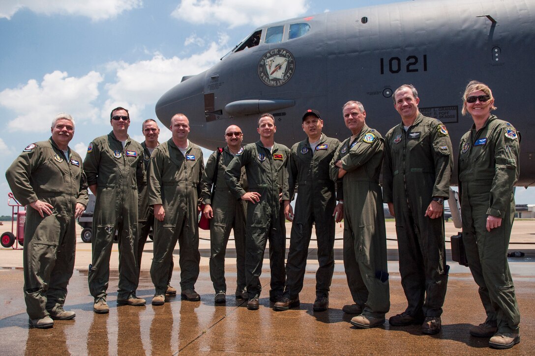 An aircrew stands for a photograph to commemorate the final flights of Col. Denis Heinz and Lt. Col. Pete Costas June 7, 2015, Barksdale Air Force Base, La. Heinz will be leaving the 307th Bomb Wing to command the 489th Bomb Group at Dyess AFB, Texas, and Costas is retiring from the Air Force Reserve after almost 30 years of service. (U.S. Air Force photo by Master Sgt. Dachelle Melville/Released)