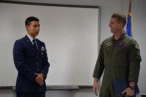 Leonel Martinez, Del Rio High School 2015 graduate, and Lt. Col. Robert Moschella, 434th Flying Training Squadron commander, stand before the Order of Daedalians chapter meeting at the 86th Flying Training Squadron on Laughlin Air Force Base, Texas, June 4, 2015. Moschella delivered some initial remarks about Martinez before he received his certificate for the “New UPT Pilot Recruiting Scholarship.” (U.S. Air Force photo by 2nd Lt. Jonathan Monsalve)