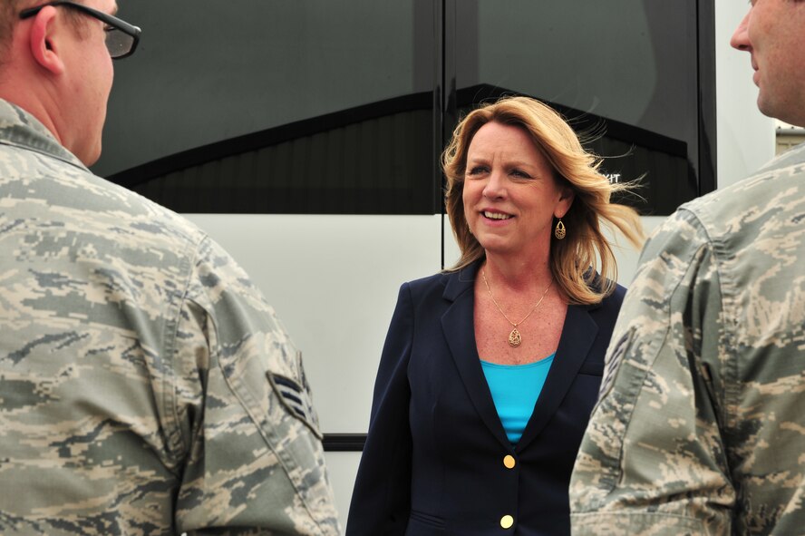 Secretary of the Air Force Deborah Lee James speaks to Senior Airman Matthew Stacy, 5th Aircraft Maintenance Squadron electric countermeasures technician, during her visit to Royal Air Force Fairford, England, June 17, 2015. James visited RAF Fairford to observe the forward-deployed forces performing their mission in the European area of operations during the BALTOPS 15 and Saber Strike 15 multi-national exercises. (U.S. Air Force photo/Senior Airman Malia Jenkins)