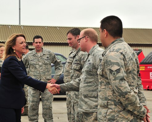 Secretary of the Air Force Deborah Lee James greets Airmen from the 23rd Expeditionary Bomb Squadron aircraft maintenance team during her visit to Royal Air Force Fairford, England, June 17, 2015. Over 300 military personnel from five U.S. bases deployed to RAF Fairford in support of a bomber deployment which trained personnel in hot-pit refueling and engine-running crew changes on B-2 Spirits and supported B-52 Stratofortress missions in the multi-national exercises BALTOPS 15 and Saber Strike 15. James visited the base to see how the Airmen completed their mission in a forward-deployed location.  (U.S. Air Force photo/Senior Airman Malia Jenkins) 