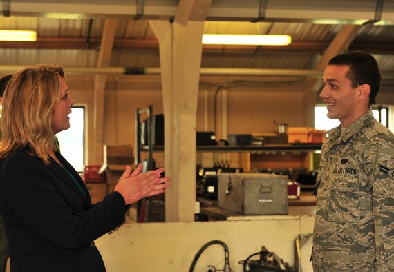 Secretary of the Air Force Deborah Lee James speaks to Airman 1st Class Cody Crawford, 5th Maintenance Squadron aerospace ground equipment technician, during her visit to Royal Air Force Fairford, England, June 17, 2015. Over 300 military personnel from five U.S. bases deployed to RAF Fairford in support of a bomber deployment which trained personnel in hot-pit refueling and engine-running crew changes on B-2 Spirits and supported B-52 Stratofortress missions in the multi-national exercises BALTOPS 15 and Saber Strike 15. James visited the base to see how the Airmen completed their mission in a forward-deployed location. (U.S. Air Force photo/Senior Airman Malia Jenkins) 