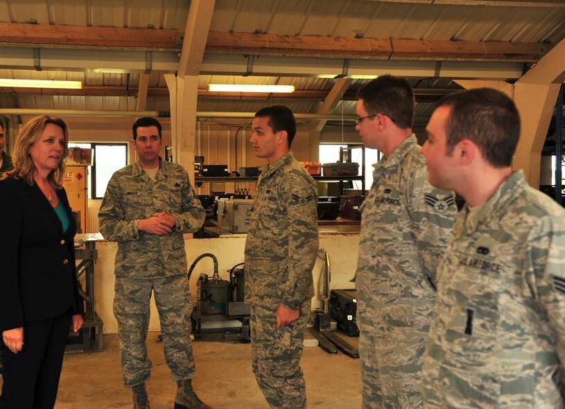 Secretary of the Air Force Deborah Lee James greets Airmen from the 23rd Expeditionary Bomb Squadron maintenance team during her visit to Royal Air Force Fairford, England, June 17, 2015. James visited RAF Fairford to observe the forward-deployed forces performing their mission in the European area of operations during the BALTOPS 15 and Saber Strike 15 multi-national exercises. (U.S. Air Force photo/Senior Airman Malia Jenkins)  