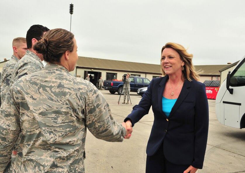 Secretary of the Air Force Deborah Lee James greets 1st Lt. Kimberly Jackson, 23rd Expeditionary Bomb Squadron maintenance officer in charge, during her visit to Royal Air Force Fairford, England, June 17, 2015. James visited RAF Fairford to observe the forward-deployed forces performing their mission in the European area of operations during their support of the BALTOPS 15 and Saber Strike 15 multi-national exercises. (U.S. Air Force photo/Senior Airman Malia Jenkins) 