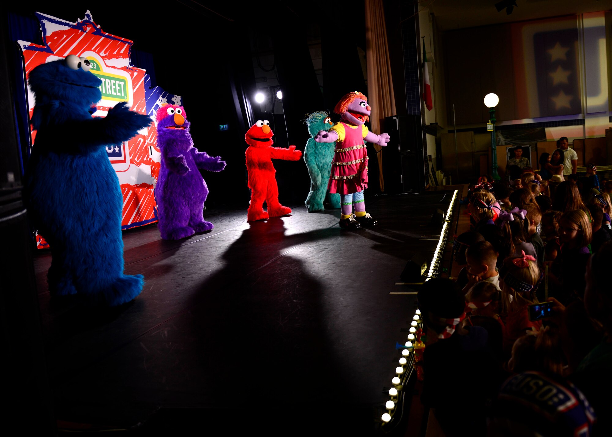 Characters perform during the Sesame Street/USO Experience for Military Families show, June 16, 2015, at Aviano Air Base, Italy. The show encouraged children to have fun while learning important tools for transitioning to civilian life or to a new to a new base. The show is scheduled to perform more than 100 shows at 45 military bases in nine countries. (U.S. Air Force photo by Senior Airman Areca T. Wilson/Released)