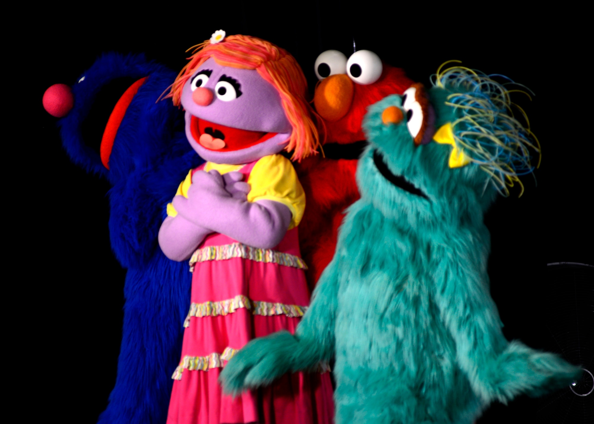Characters perform during the Sesame Street/USO Experience for Military Families show, June 16, 2015, at Aviano Air Base, Italy. The show focused on the military child’s transition to civilian life or to a new base called “Katie’s Family Transitions to Civilian Life” and “Katie is Moving to a New Base.” The show is scheduled to perform more than 100 shows at 45 military bases in nine countries. (U.S. Air Force photo by Senior Airman Areca T. Wilson/Released) 