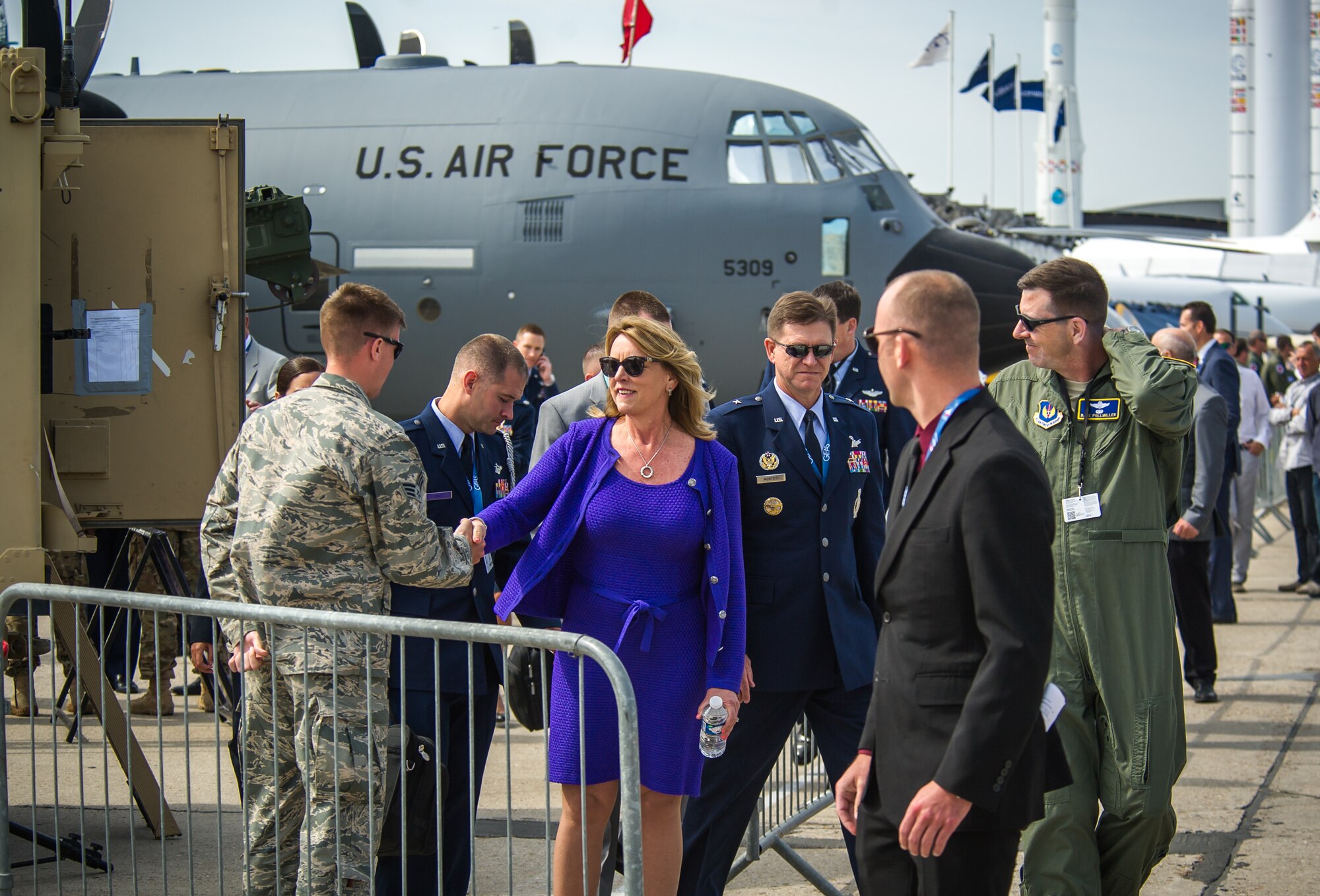 PARIS -- Secretary of the Air Force Deborah Lee James greets a security forces Airman during the Paris Air Show at Le Bourget Airport, France, June 16, 2015. The Paris Air Show provides a collaborative opportunity to share and strengthen the U.S. and European strategic partnership that has been forged during the last seven decades and is built on a foundation of shared values, experiences and vision. The event is expected to bring in 315,000 people, a record 2,215 companies, 150 aircraft, and will span 324,000 square meters. (U.S. Air Force photo/ Tech. Sgt. Ryan Crane)