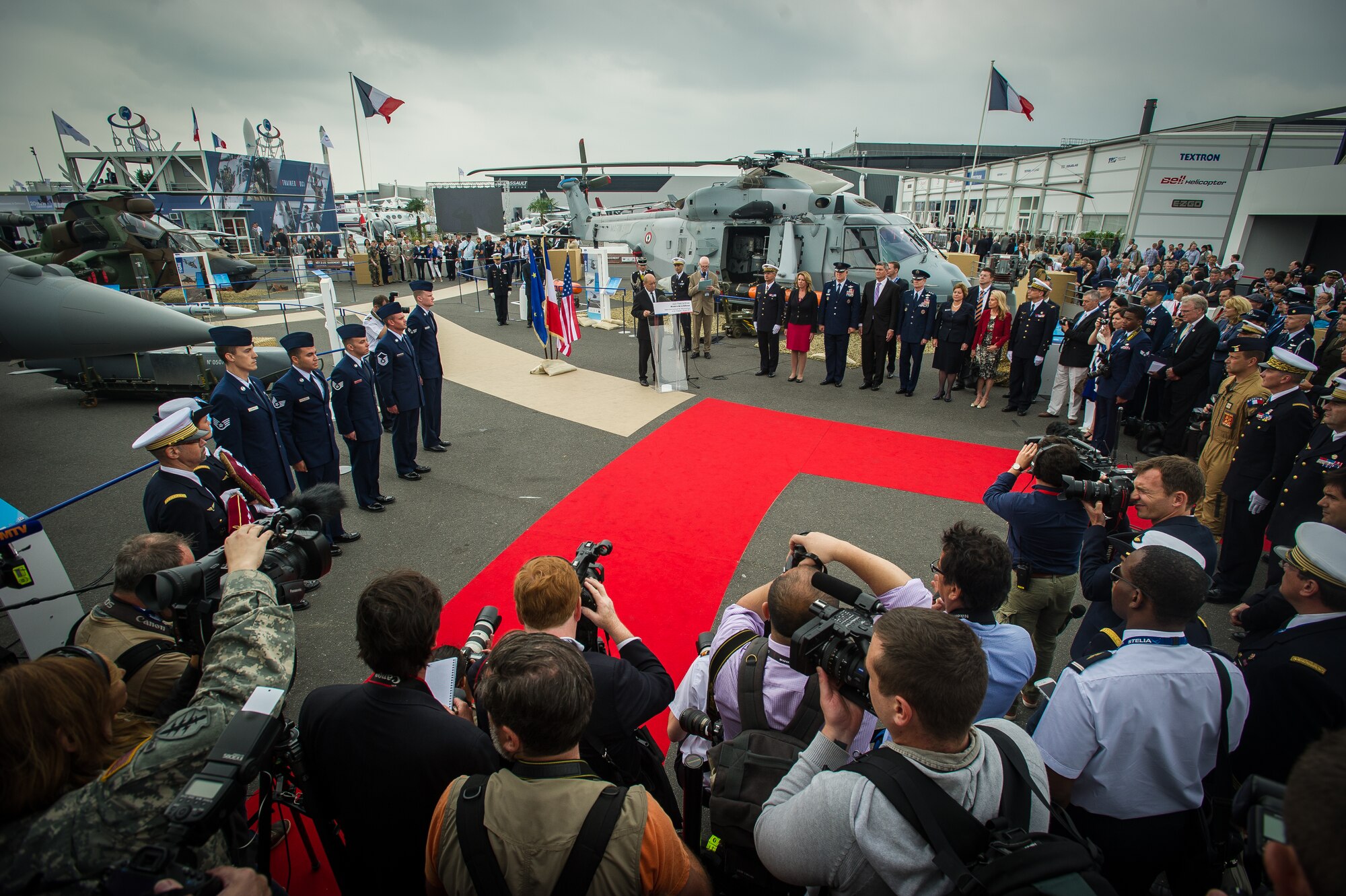 PARIS -- French Minister of Defence Jean Yves Le Drian pins the French Legion of Honor medal on Staff Sgt. Greggory Swarz at Le Bourget Airport during the International Paris Air Show, June 15, 2015. Swarz was recognized for his heroic actions on Jan. 26, 2015, when he saved the lives of three French airmen after a Hellenic air force F-16 Fighting Falcon crashed into the parking ramp at Los Llanos Air Base, Spain, during Tactical Leadership Program 15-1. Swarz is a 492nd Aircraft Maintenance Unit electrical environmental systems specialist assigned to RAF Lakenheath, U.K. (U.S. Air Force photo/ Tech. Sgt. Ryan Crane)