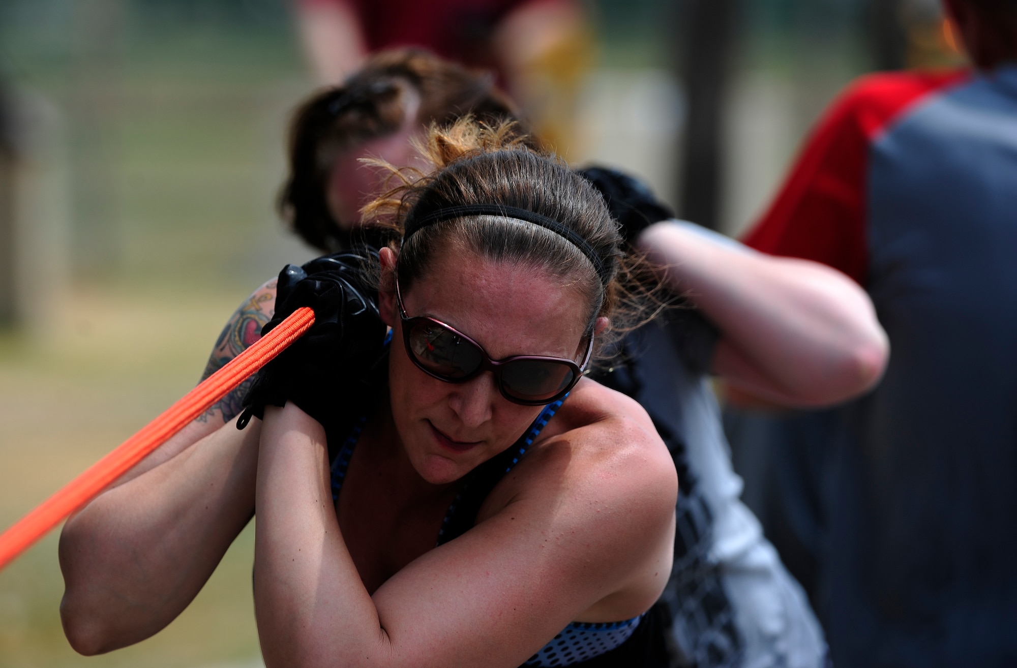 Master Sgt. Shiona Meyer, 8th Medical Group 1st Sgt., participates in a fire truck pull during a fire muster at the Wolf Pack Fitness Center on Kunsan Air Base, Republic of Korea, June 13, 2015. The fire muster gave Airmen in career fields from all over the wing an opportunity to test their fitness abilities against one another. (U.S. Air Force photo by Staff Sgt. Nick Wilson/Released)