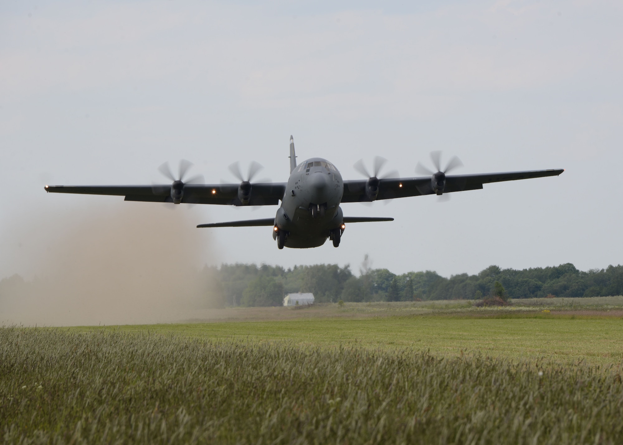 A C-130J Hercules assigned to the 37th Airlift Squadron, Ramstein Air Base, Germany, takes off from a field in Nurmsi, Estonia, during an austere landing exercise for Saber Strike 15. Saber Strike is an exercise that aims to continue to improve U.S., allied partners, and participating nations' interoperability, while increasing their capacity to conduct a full spectrum of military operations. (Air National Guard photo/ Tech. Sgt. Christopher Schepers)