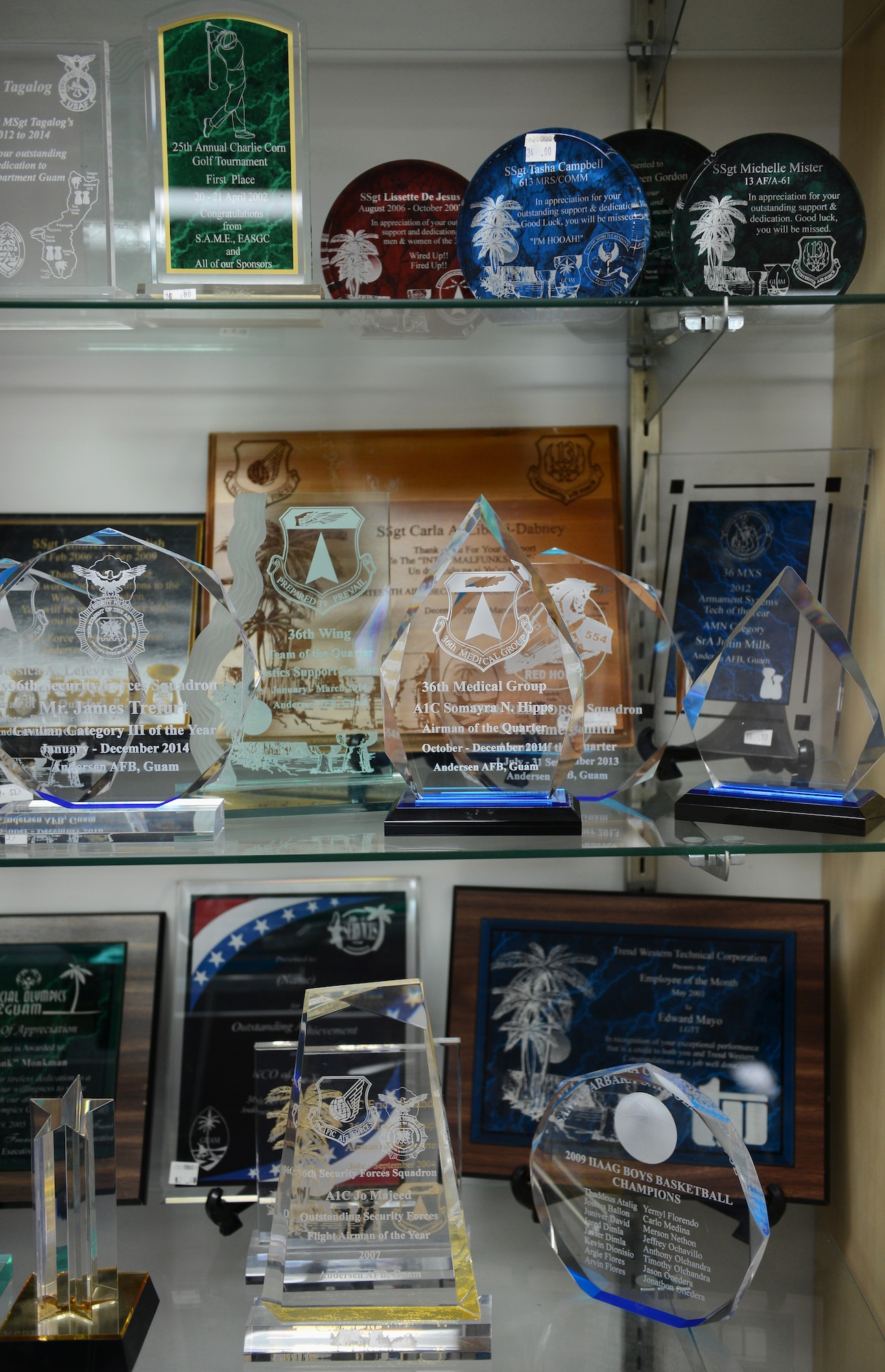 A number of plaques and rewards made by 36th Force Support Squadron Arts and Crafts Center members are on display June 10, 2015, at Andersen Air Force Base, Guam. The Arts and Crafts Center provides engraving and framing services as well as a wide variety of classes for people of all ages. (U.S. Air Force photo by Airman 1st Class Arielle Vasquez/Released)