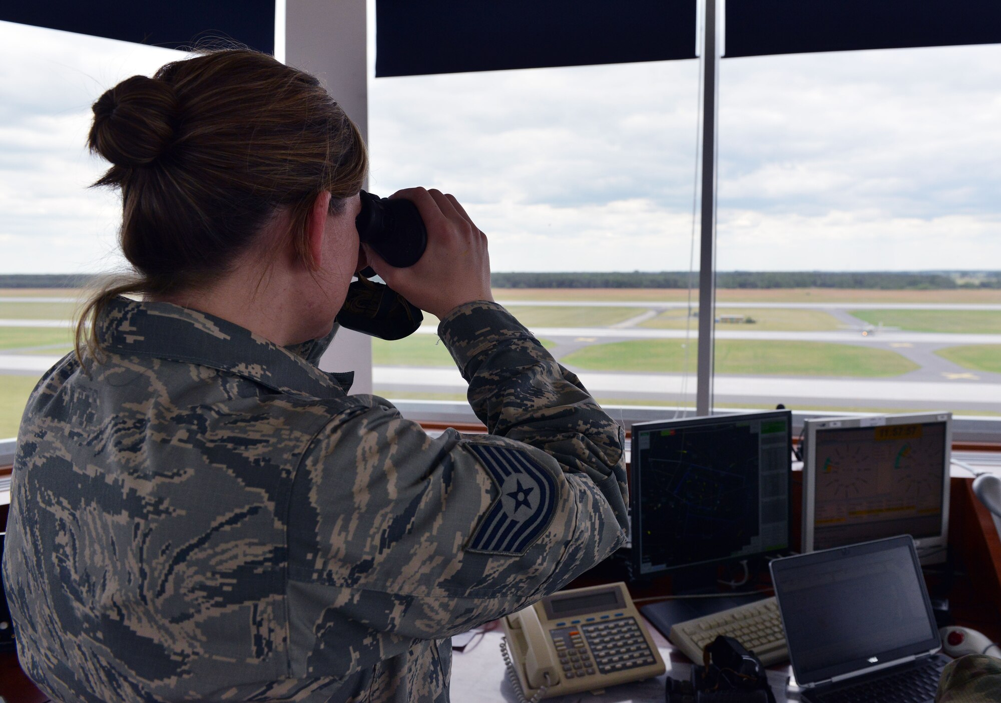 Tech. Sgt. Lauren Crowell, 100th Operations Support Squadron air traffic controller, watches a Polish aircraft taxi down the runway as part of Baltic Operations 2015, June 16, 2015, at Powidz Air Base, Poland. BALTOPS is a multinational maritime exercise in Poland, Sweden, Germany, and throughout the Baltic Sea, including participation from 14 NATO and three partner nations taking place June 5-20. (U.S. Air Force photo by Senior Airman Michael Battles)