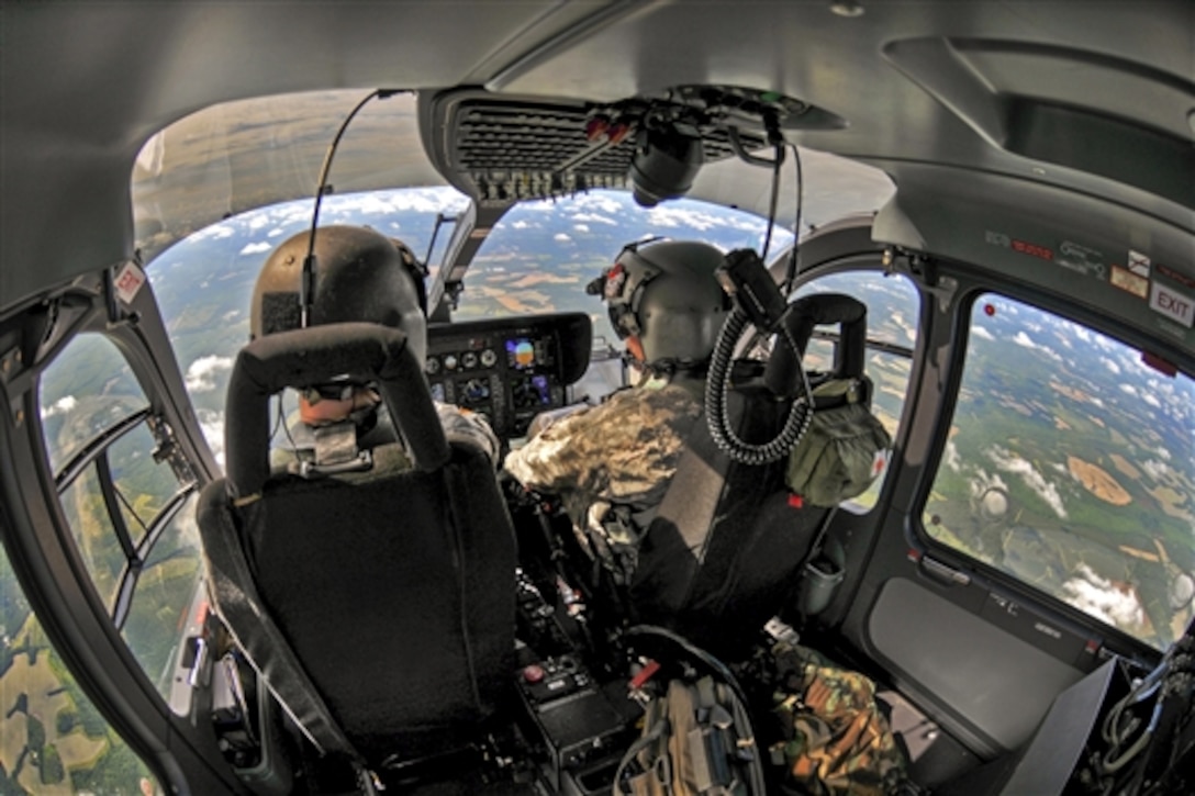 Army Maj. Brian Vorse, left, and Army Cpt. Chris Jones fly a UH-72A Lakota helicopter over South Carolina’s major hurricane escape routes, June 10, 2015. 