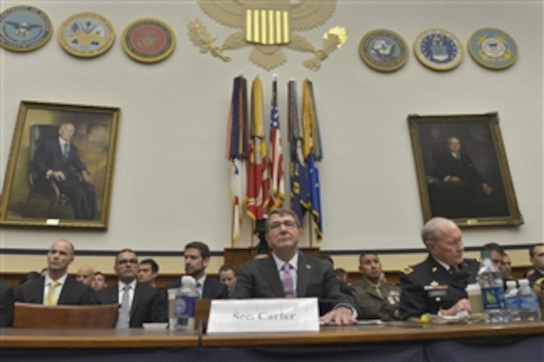 Defense Secretary Ash Carter, center, and Army Gen. Martin E. Dempsey, right, chairman of the Joint Chiefs of Staff, appear before the House Armed Services Committee in Washington, D.C., to testify on U.S. policy and strategy in the Middle East, July 17, 2015.