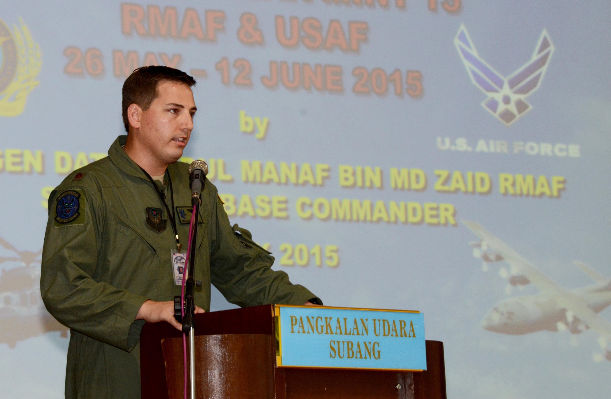 Maj. Michael Perry, Exercise Teak Mint mission commander and an instructor pilot from the 17th Special Operations Squadron, gives a speech during the opening ceremony held May 30, 2015 at Subang Air Base, Malaysia. The 353rd Special Operations Group, from Kadena Air Base, Japan, along with the 36th Airlift Squadron, from Yokota Air Base, Japan. 