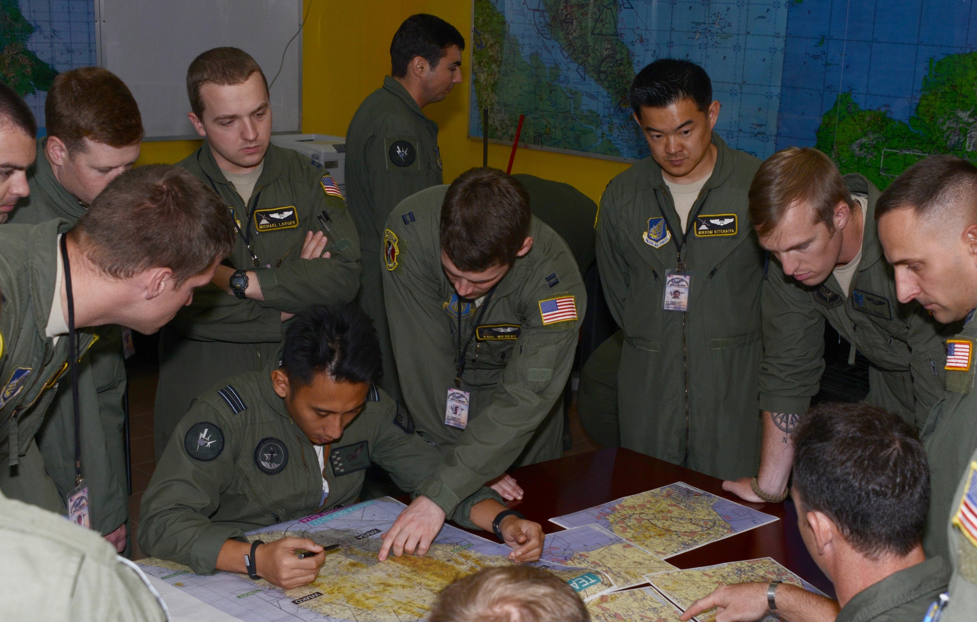 A Royal Malaysian Air Force pilot familiarizes crews from the 36th Airlift Squadron and the 17th Special Operations Squadron with the local area May 30, 2015 at Subang Air Base, Malaysia. The 353rd Special Operations Group, from Kadena Air Base, Japan, along with the 36th Airlift Squadron, from Yokota Air Base, Japan, are participating in Joint Chiefs of Staff Exercise Teak Mint with the Royal Malaysian Air Force, a multinational and bilateral training used to enhance capabilities and capacities between the two countries.  (U.S. Air Force photo by Tech. Sgt. Kristine Dreyer)