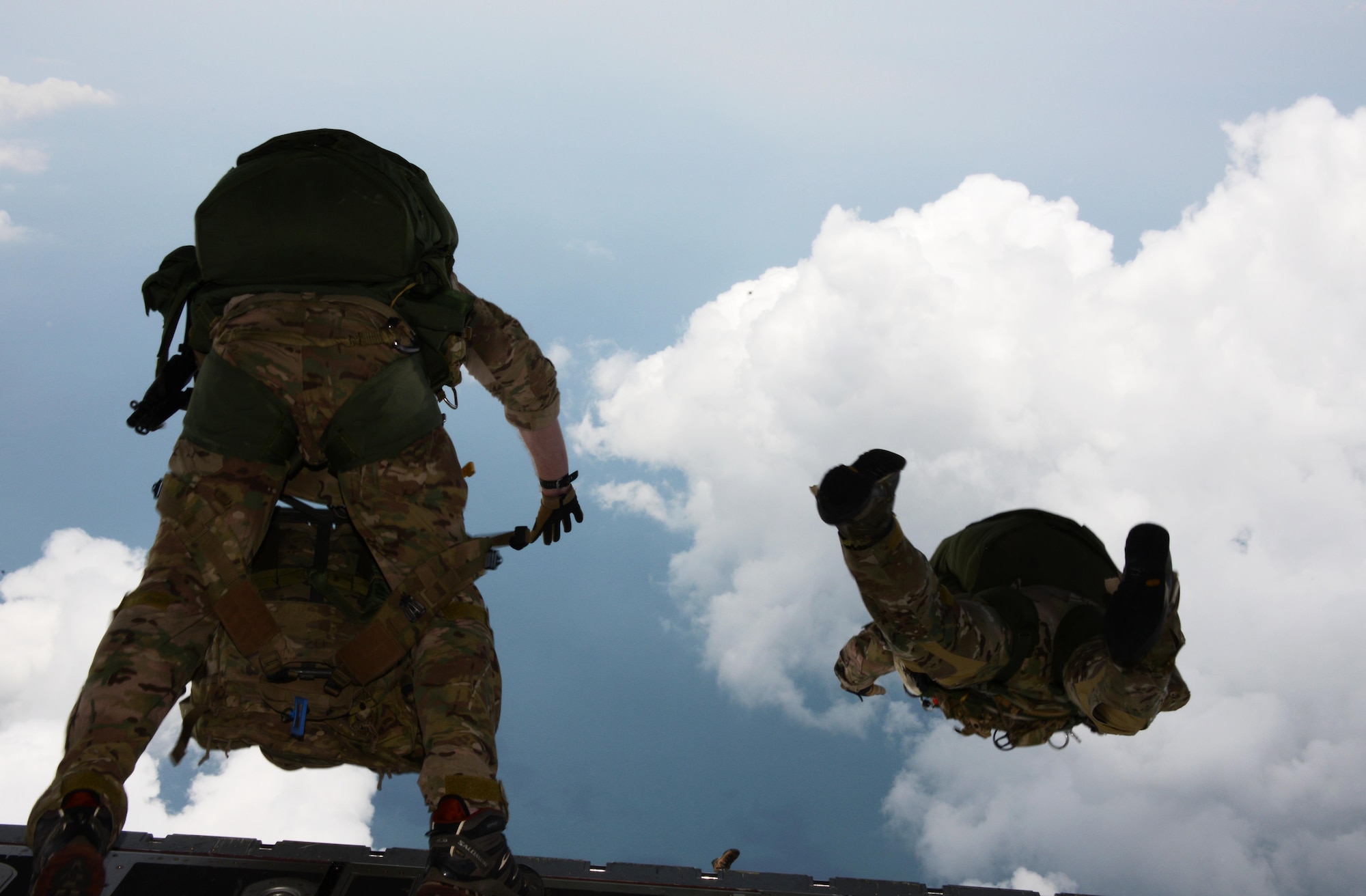 Special Tactics Airmen from the 320th Special Tactics Squadron and the 22nd Special Tactics Squadron jump from an MC-130J Commando II near Kuantan, Malaysia, June 8, 2015.  The high-altitude low-opening jumps were conducted as part of Exercise Teak Mint, a multinational and bilateral exercise between the Royal Malaysian Air Force and the U.S. Air Force.  (U.S. Air Force photo by Tech. Sgt. Kristine Dreyer)