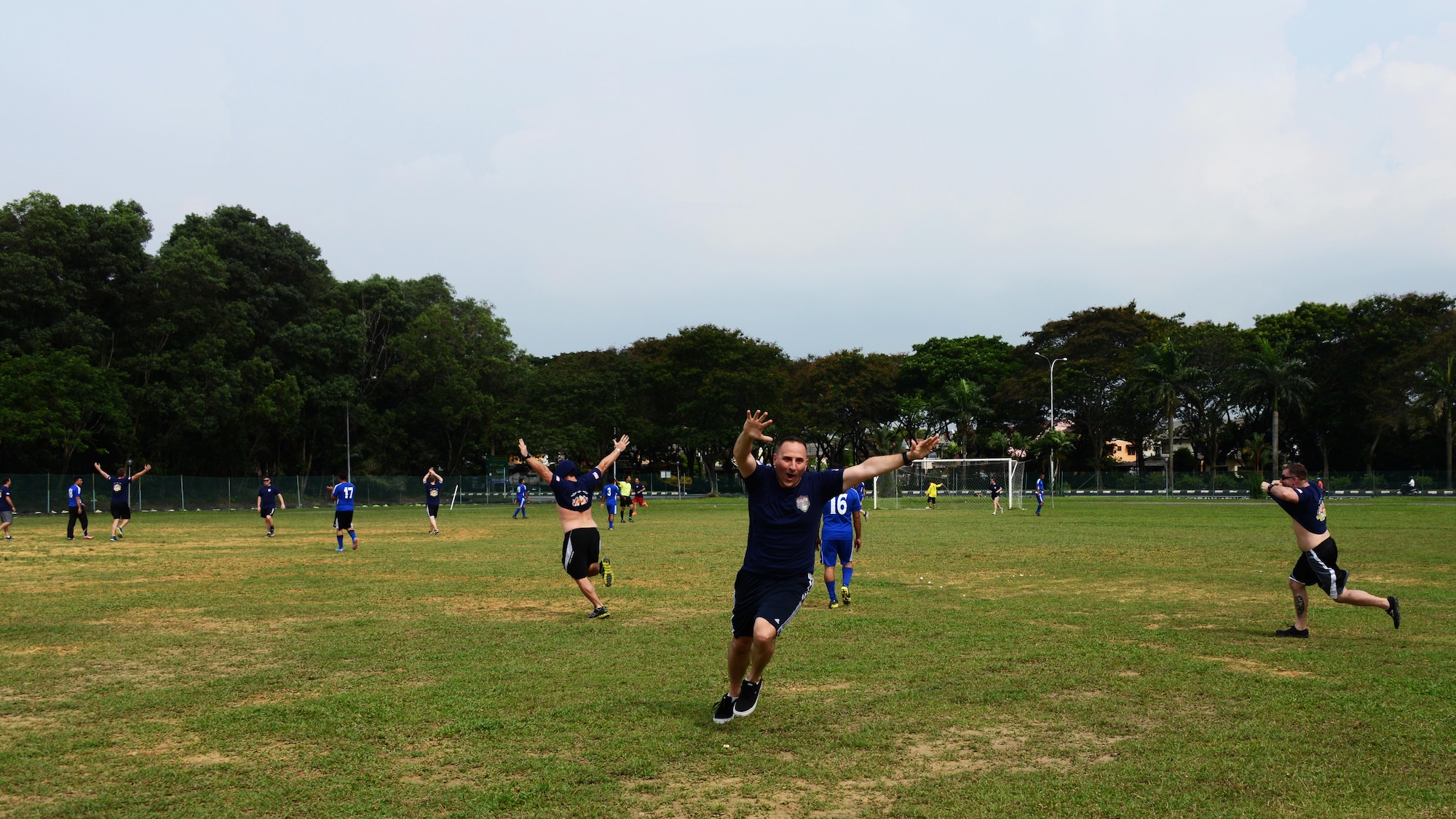 The U.S. Air Force team comprised of members from the 353rd Special Operations Group and the 36th Airlift Squadron celebrates their first goal during a friendly soccer match between the U.S. Air Force and the Royal Malaysian Air Force June 9, 201 near Subang Air Base, Malaysia.  The match was played as part of Teak Mint, a multinational and bilateral training exercise held to improve interoperability to between the U.S. Air Force and the Royal Malaysian Air Force.  The Royal Malaysian Air Force team won the match 4-3.   (U.S. Air Force photo by Tech. Sgt. Kristine Dreyer)
