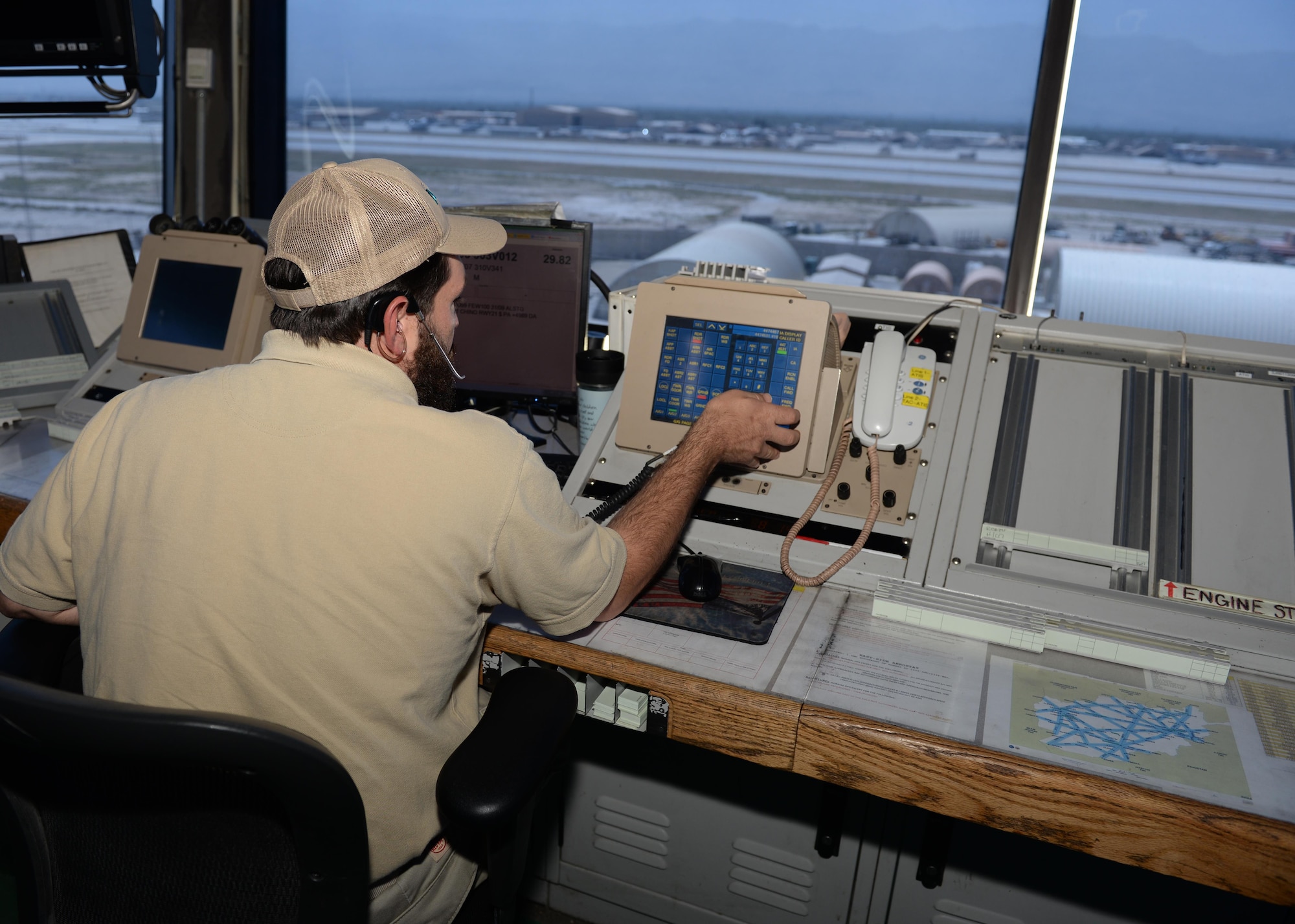 A Midwest Air Traffic Control member checks flight information on the control system June 17, 2015, at Bagram Airfield, Afghanistan. The Midwest team has managed Bagram’s air traffic since 2003 and continues to support the mission by monitoring all aircraft movement coming in and out the AOR. (U.S. Air Force photo by Senior Airman Cierra Presentado/Released)
