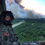 The Alaska Army National Guard supported fire suppression efforts in June 2015 in and near Willow, Alaska. UH-60 Black Hawks from the 1-207th Aviation Regiment flew multiple missions, dipping their orange water buckets into waters east of Willow Lake and dropping thousands of gallons of water over the east side of the fire, about five miles north of Willow Airport. Sgt. Sonny Cooper, a crew chief for the 1st Battalion, 207th Aviation Regiment, flew on a crew during firefighting efforts, and operated the water bucket during missions.