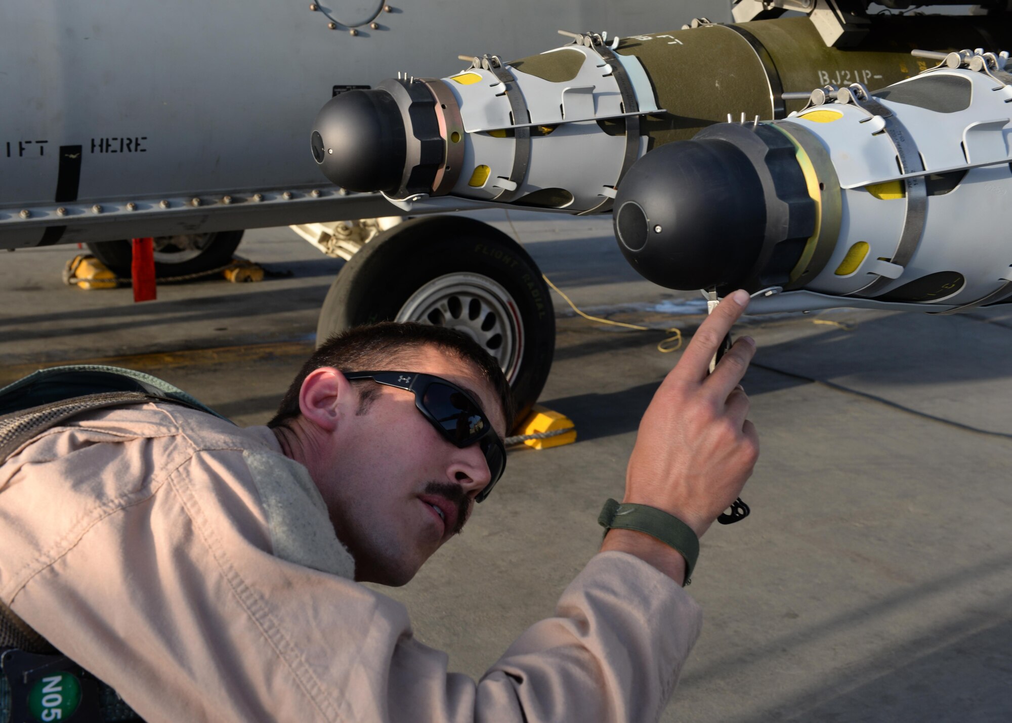 U.S. Air Force Capt. Dakota Olsen, 555th Expeditionary Fighter Squadron F-16 Fighting Falcon pilot, does a pre-flight maintenance check on his jet June 17, 2015, at Bagram Airfield, Afghanistan. Olsen’s job is to provide close air support and armed over watch for military personnel in Afghanistan. He flies various sorties and missions throughout the country on a daily basis providing airpower to ensure a safe and secure environment for personnel at BAF. (U.S. Air Force photo by Senior Airman Cierra Presentado/Released)