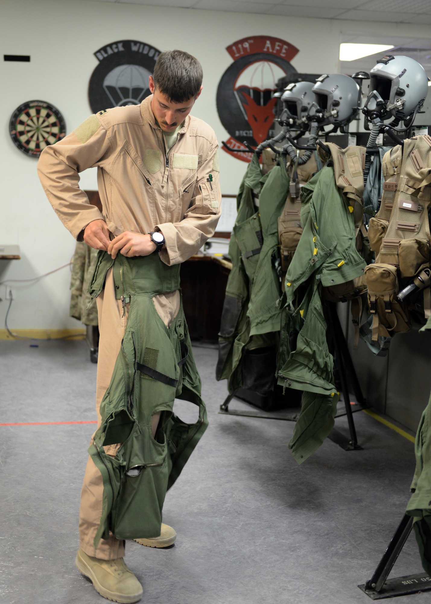 U.S. Air Force Capt. Dakota Olsen, 555th Expeditionary Fighter Squadron F-16 Fighting Falcon pilot, gears up before flying out on a mission June 17, 2015, at Bagram Airfield, Afghanistan.  Olsen’s job is to provide close air support and armed over watch for military personnel in Afghanistan. He flies various sorties and missions throughout the country on a daily basis providing airpower to ensure a safe and secure environment for personnel at BAF. (U.S. Air Force photo by Senior Airman Cierra Presentado/Released)