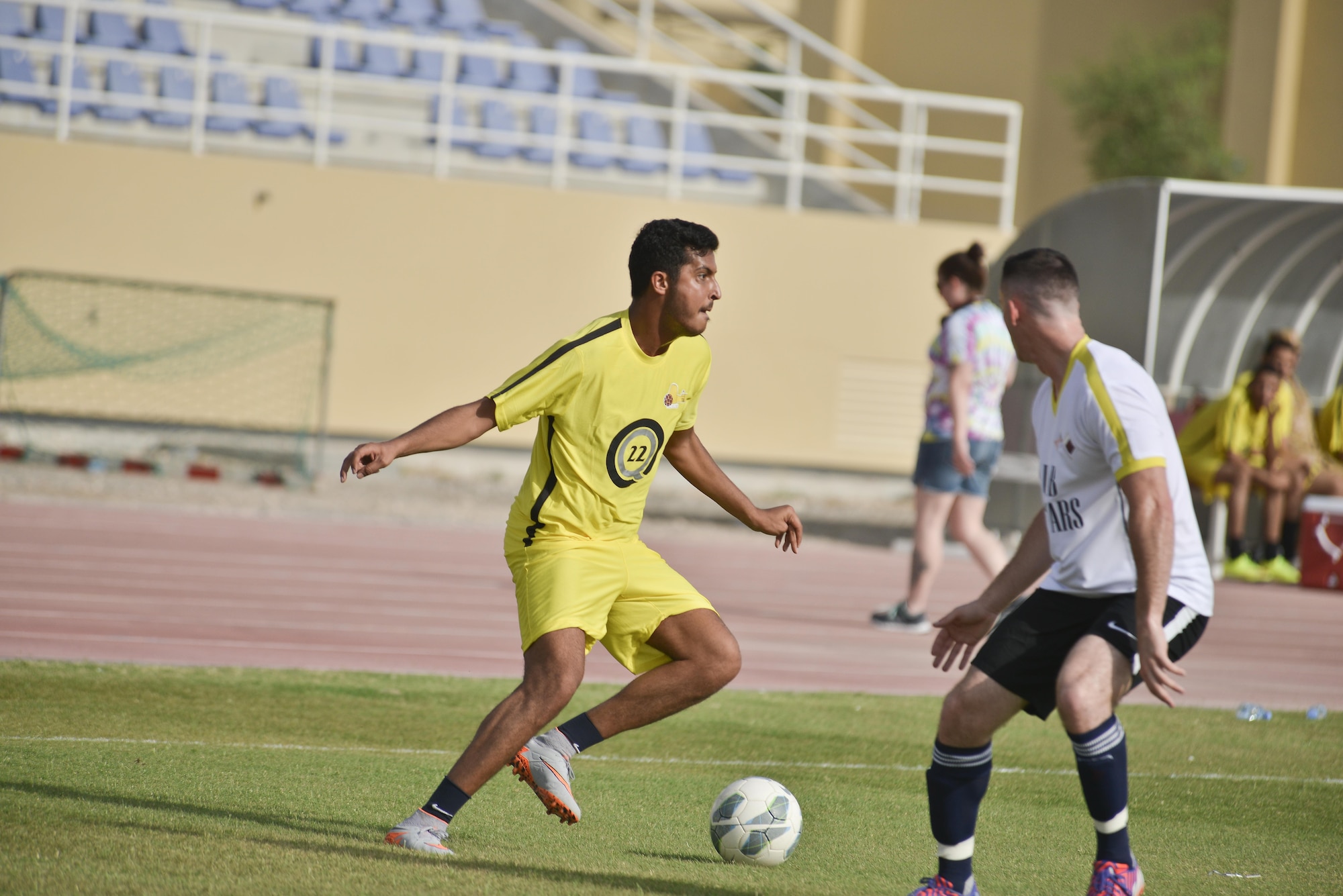 Deployed U.S. and Qatari military members play a friendly soccer match to help celebrate the 240th U.S.  Army birthday June 14, 2015 at Al Udeid Air Base, Qatar. AUAB All-Stars planned a soccer match to help strengthen the partnership between the U.S. and Qatari military and build friendships between service members. (U.S. Air Force photo/Staff Sgt. Alexandre Montes)